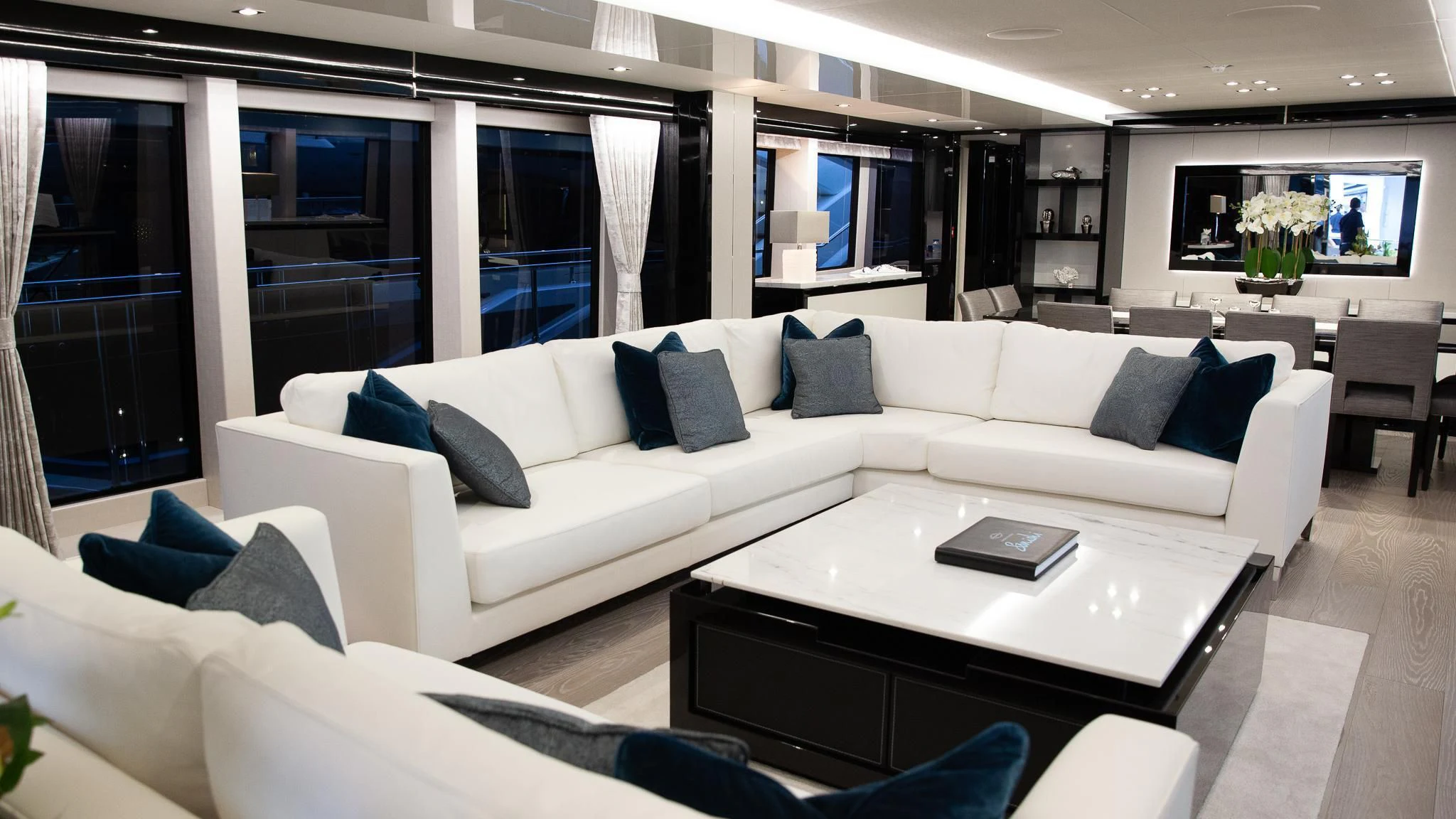 a white couch with blue pillows aboard SONISHI Yacht for Sale