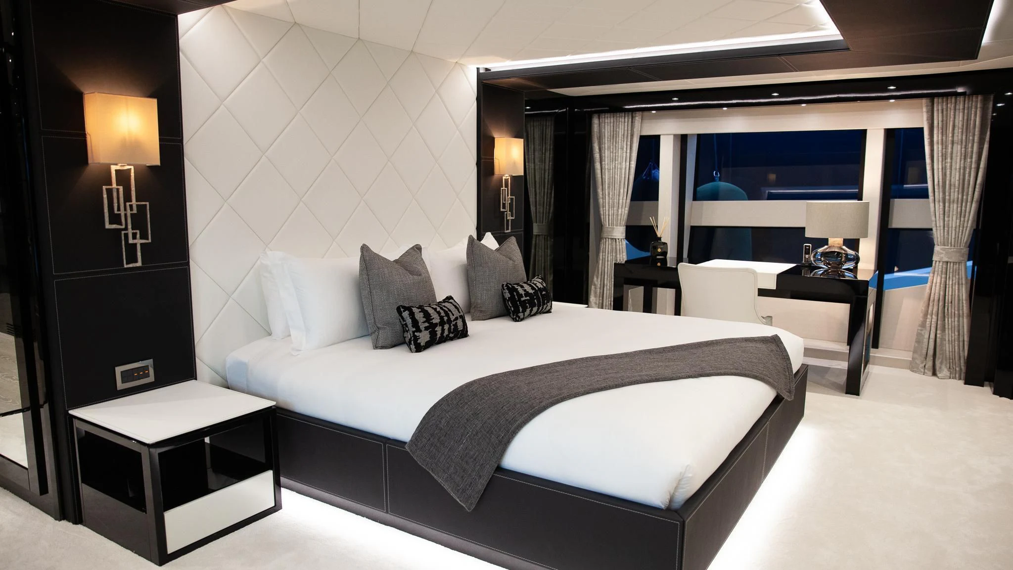 a large bed in a hotel room aboard SONISHI Yacht for Sale