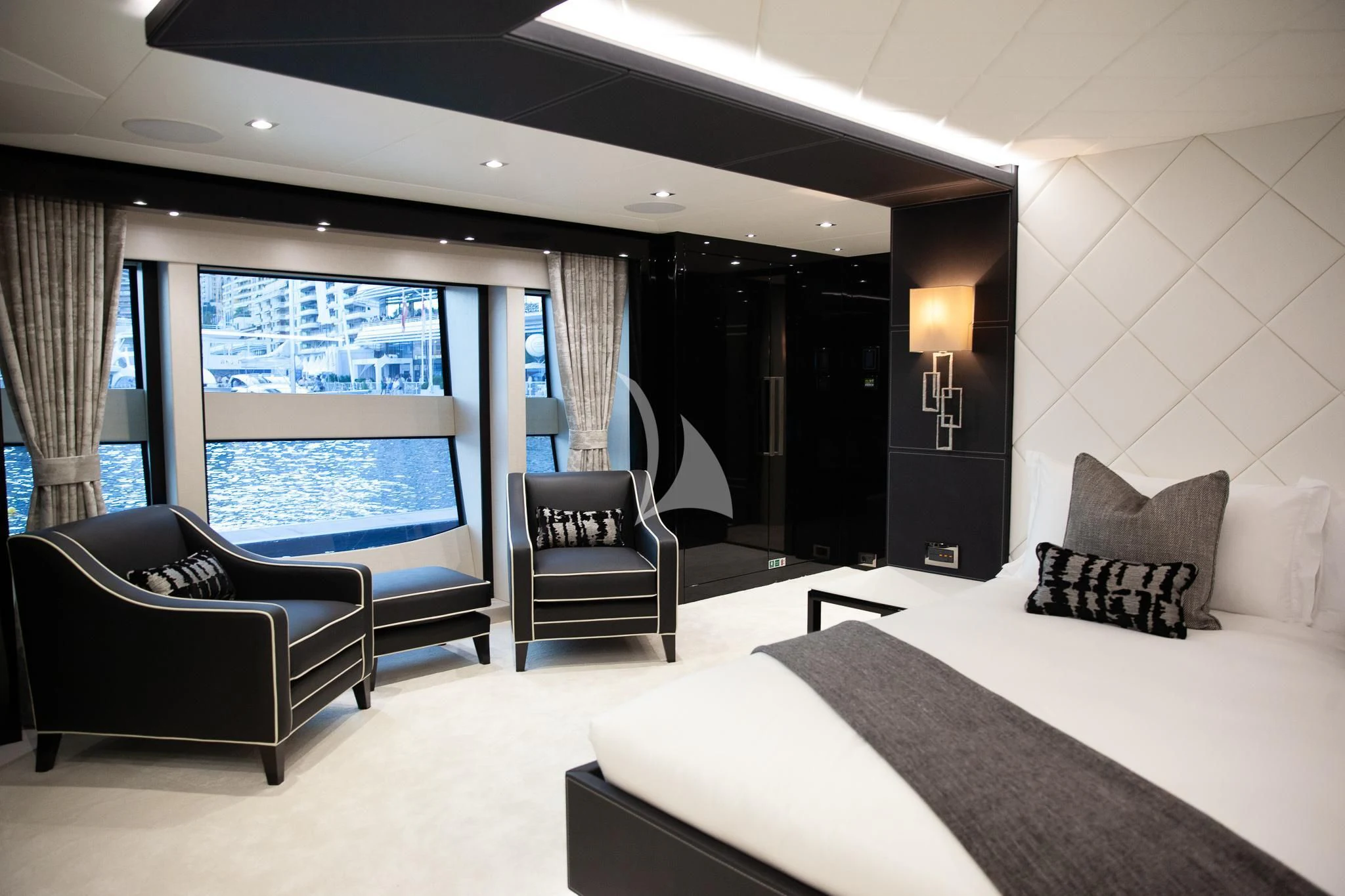 a hotel room with a bed and a chair aboard SONISHI Yacht for Sale