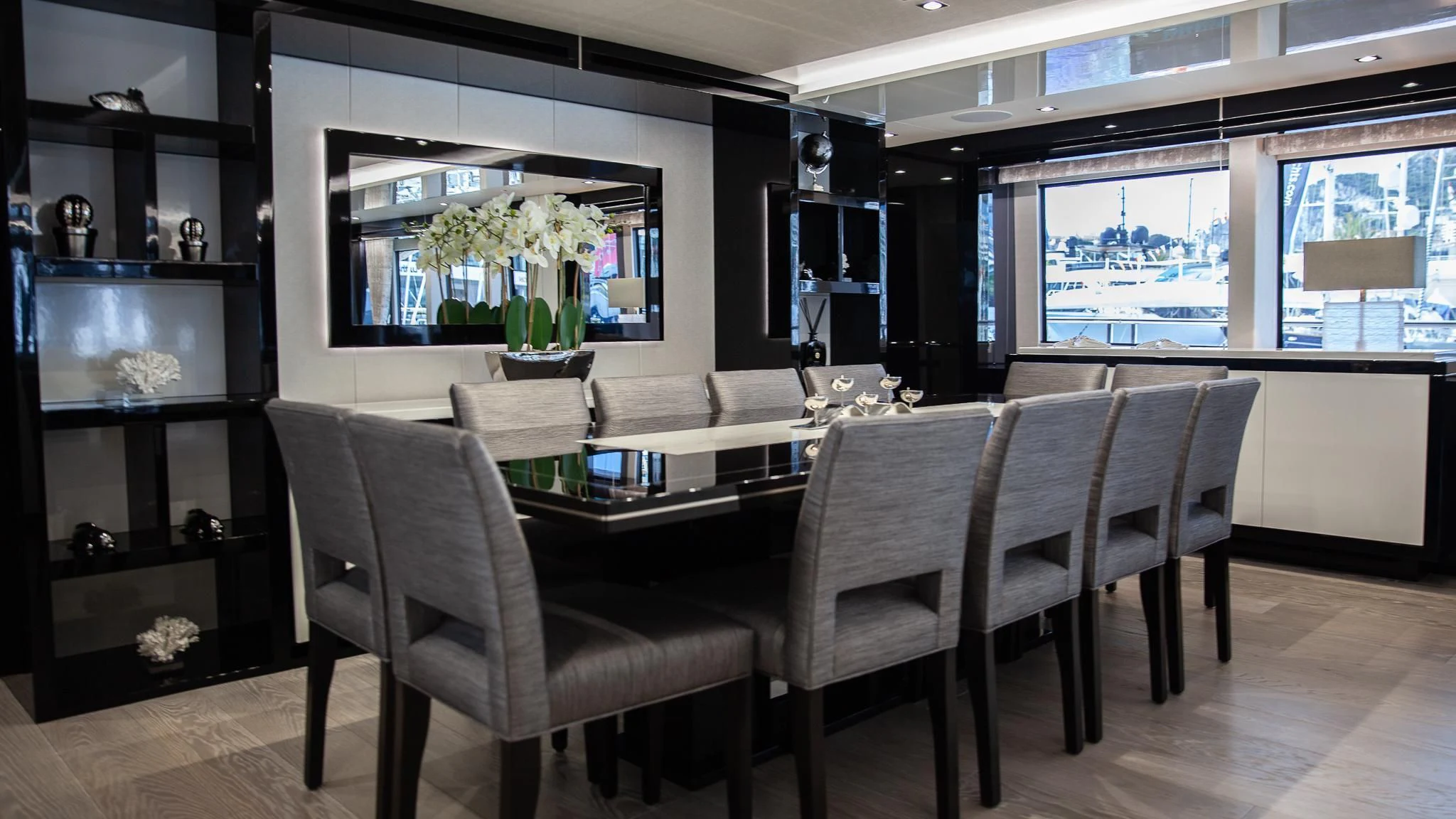 a room with a table chairs and a tv aboard SONISHI Yacht for Sale