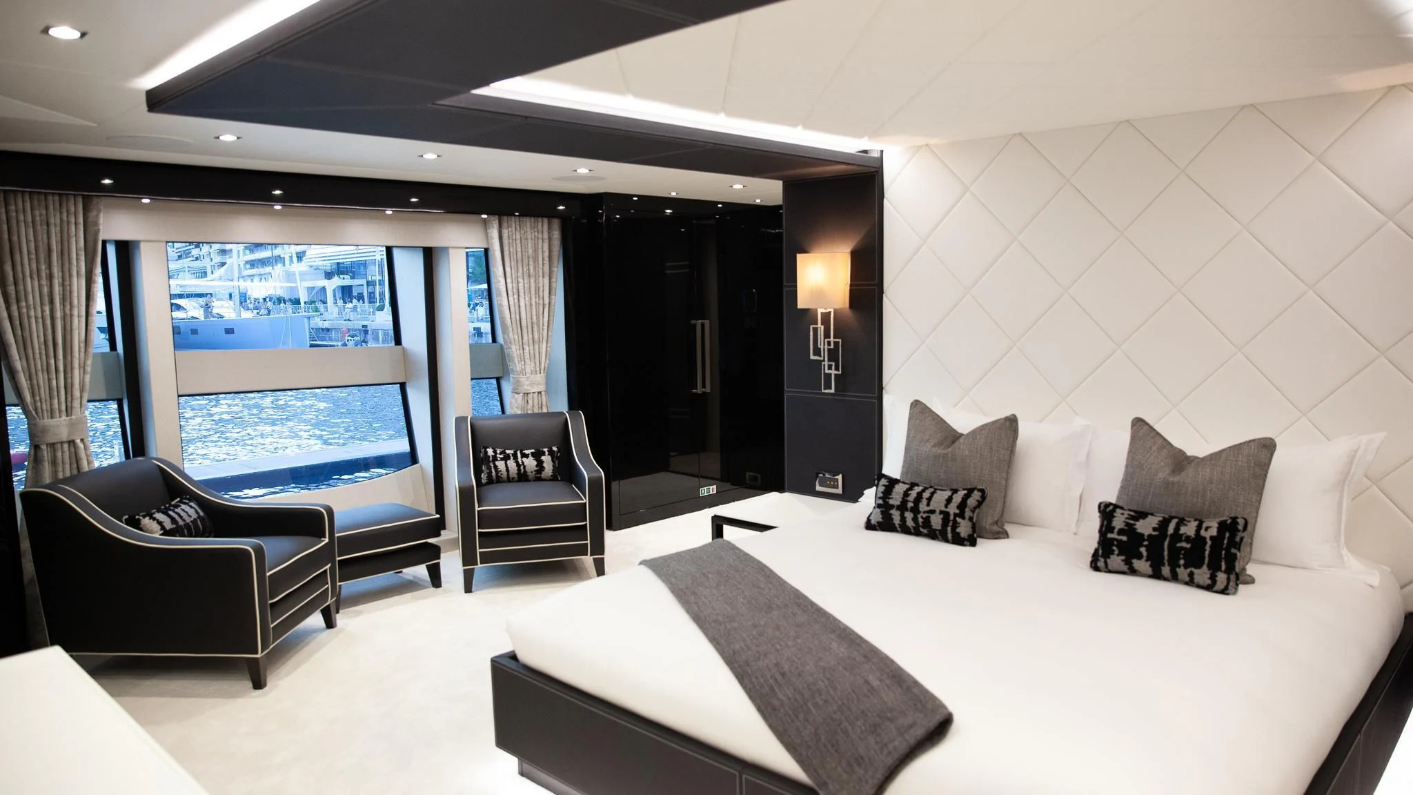 a large hotel room with a large bed and a large window aboard SONISHI Yacht for Sale