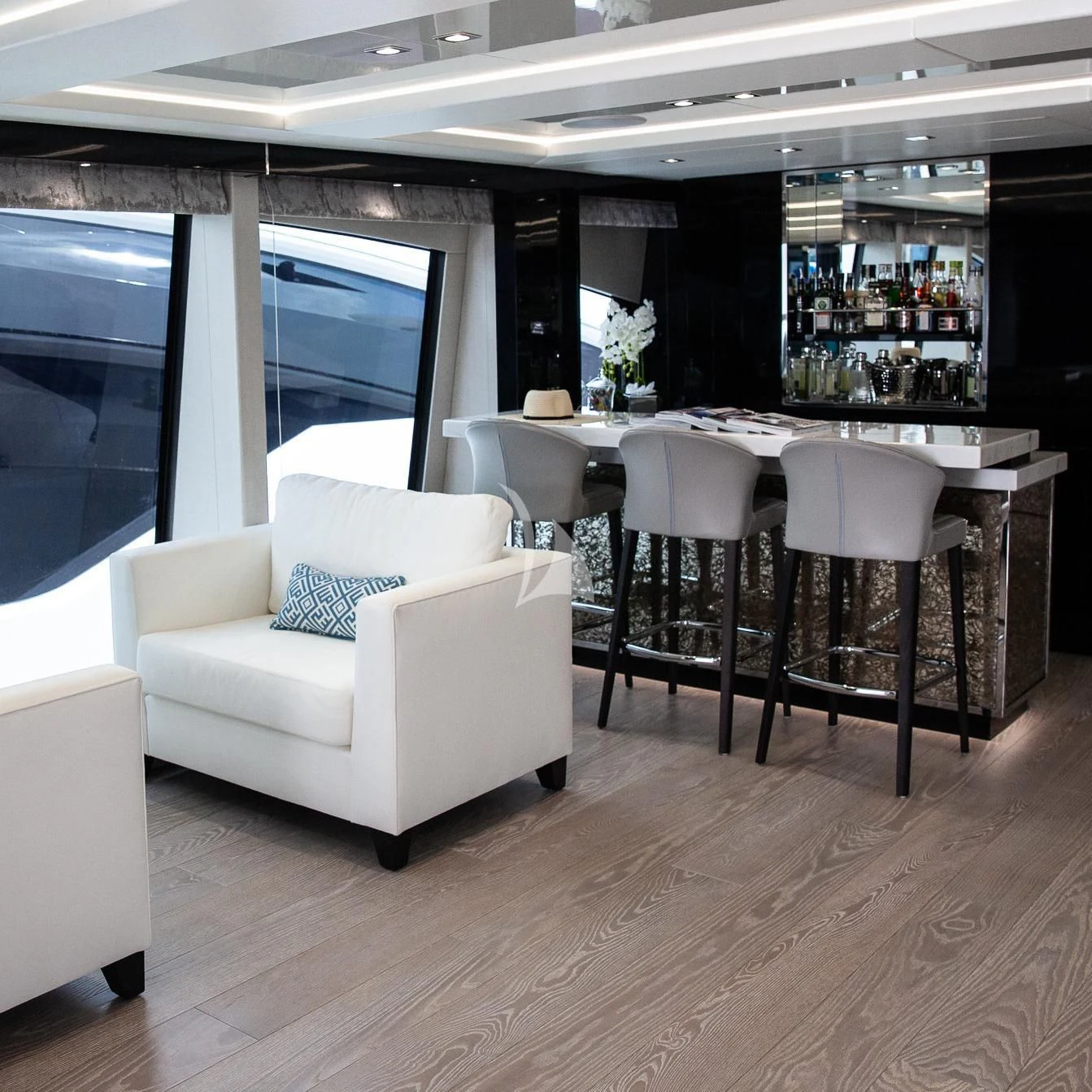 a room with a table and chairs aboard SONISHI Yacht for Sale