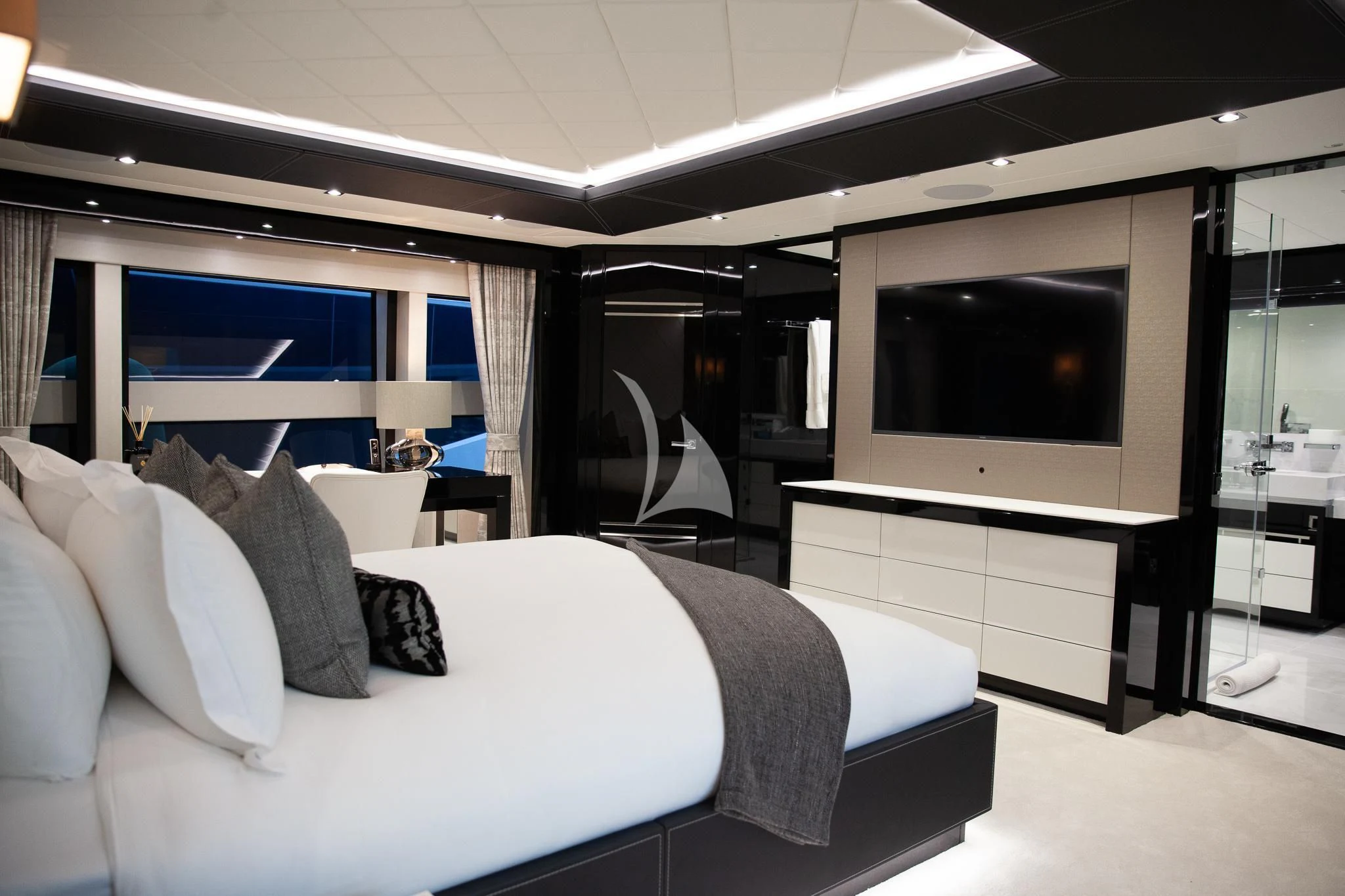 a hotel room with a bed and tv aboard SONISHI Yacht for Sale