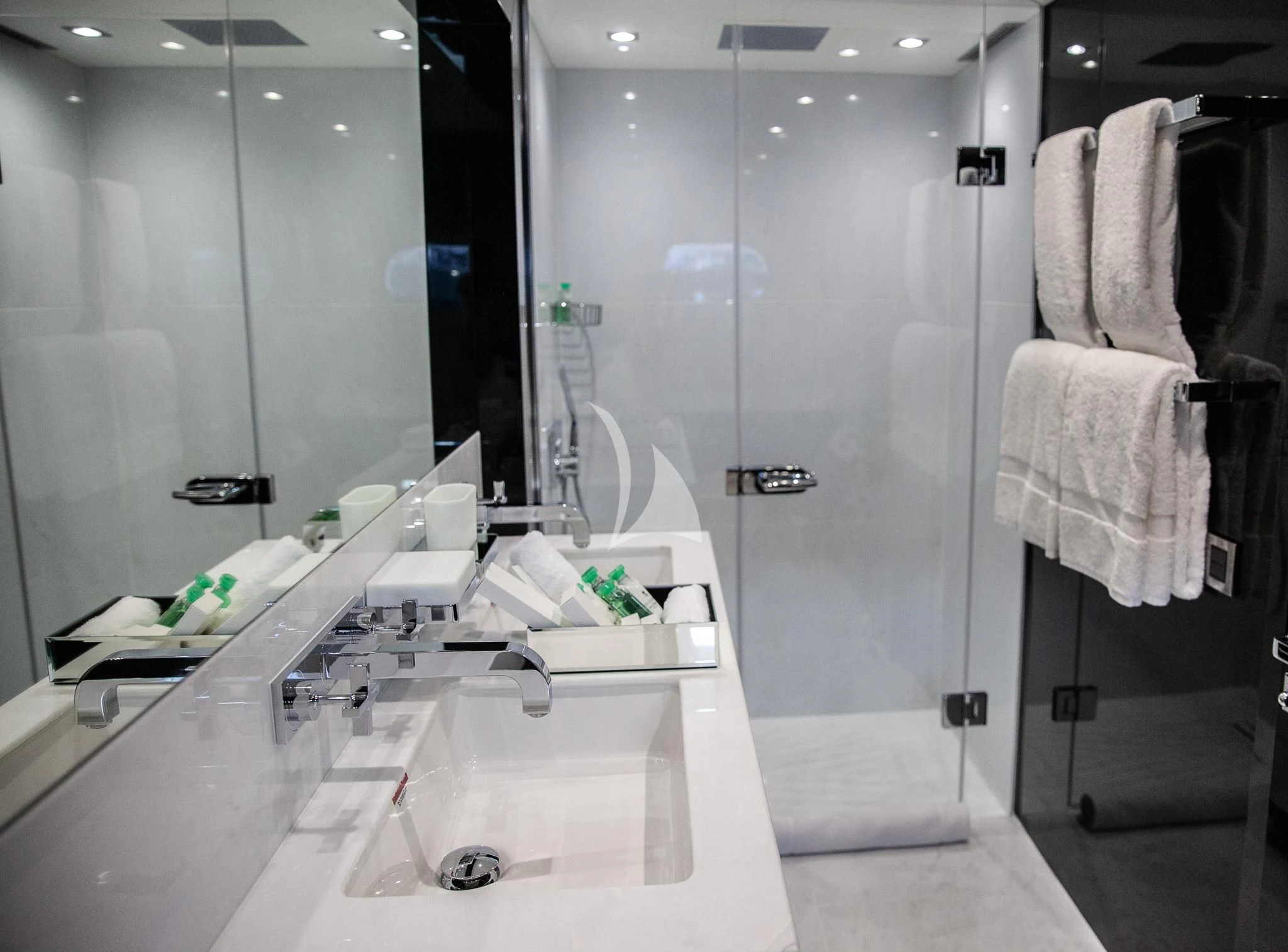 a bathroom with a large glass shower aboard SONISHI Yacht for Sale