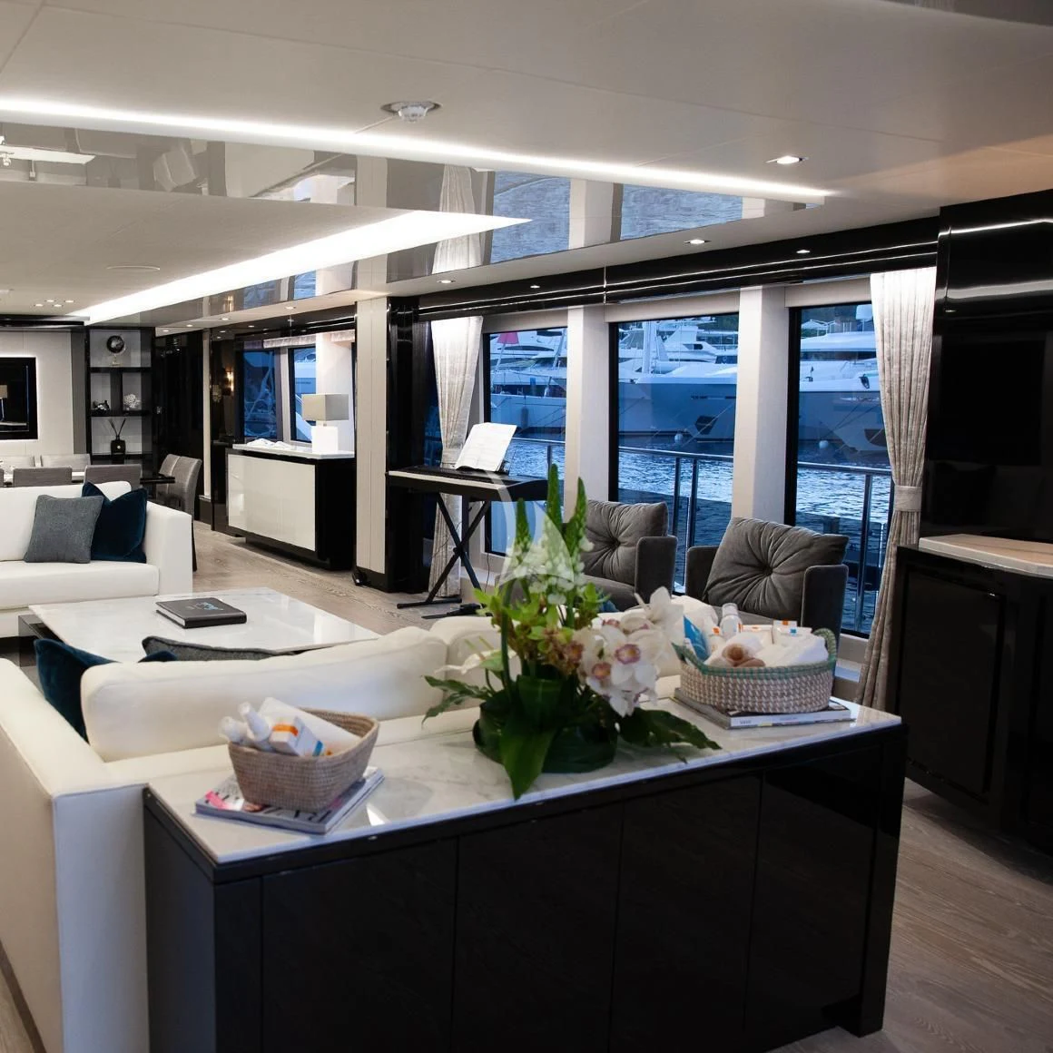 a living room with a large window aboard SONISHI Yacht for Sale