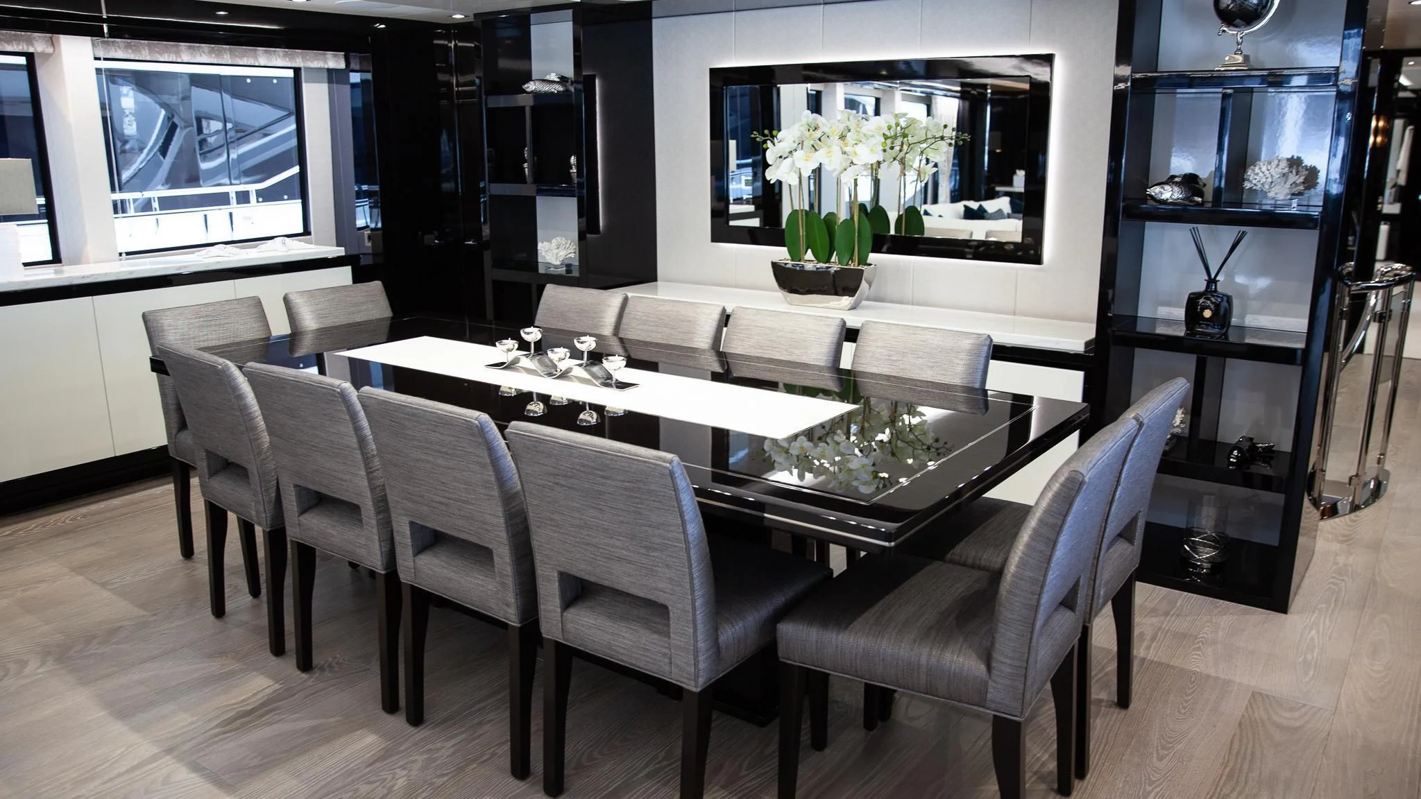 a room with a table chairs and a tv aboard SONISHI Yacht for Sale