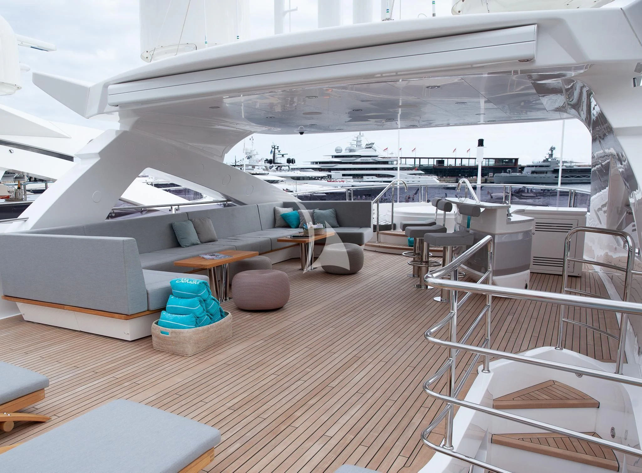 a room with tables and chairs aboard SONISHI Yacht for Sale