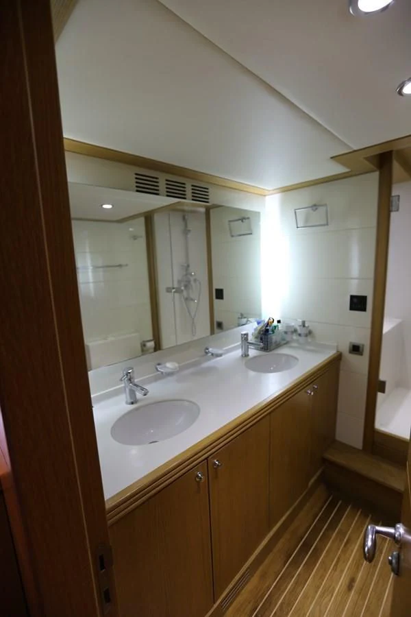 a bathroom with a large mirror aboard GOODWILL Yacht for Sale