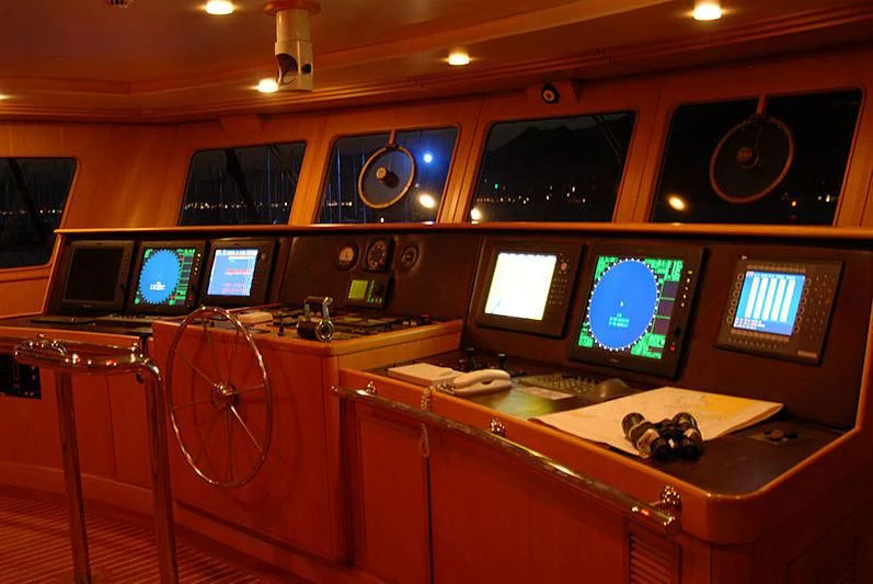 a control room with many monitors aboard GOODWILL Yacht for Sale