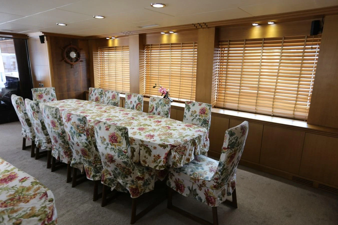 a room with a table and chairs aboard GOODWILL Yacht for Sale