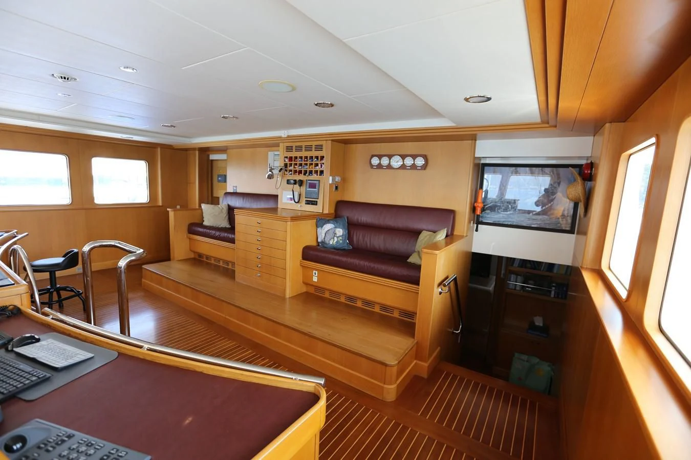 a living room with a couch and a computer aboard GOODWILL Yacht for Sale