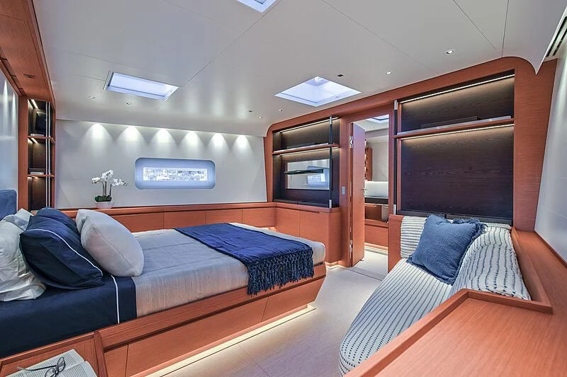 a room with a bed and a desk aboard MORGANA Yacht for Sale