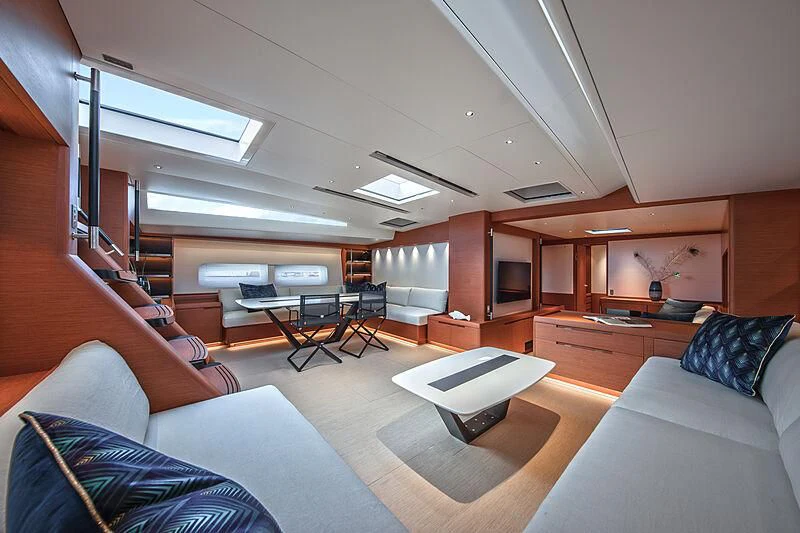 a living room with a couch and a table aboard MORGANA Yacht for Sale