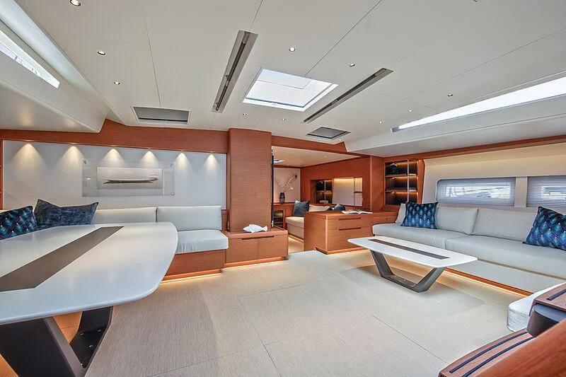 a large living room with white walls aboard MORGANA Yacht for Sale