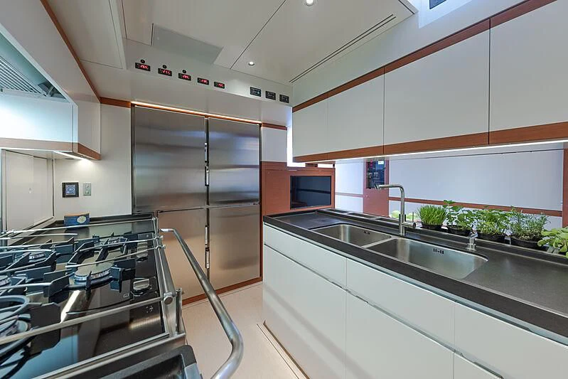 a kitchen with a stainless steel sink aboard MORGANA Yacht for Sale