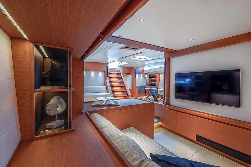 a living room with a wood floor aboard MORGANA Yacht for Sale