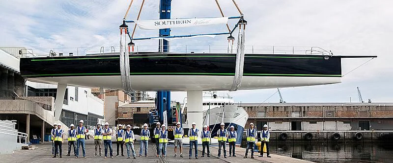 a group of people in front of a large building aboard MORGANA Yacht for Sale
