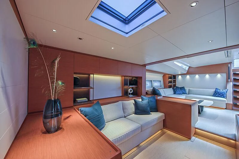 a living room with a couch and a table aboard MORGANA Yacht for Sale