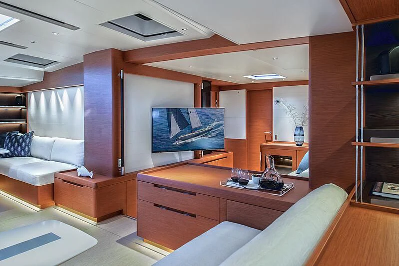 a living room with a large tv aboard MORGANA Yacht for Sale