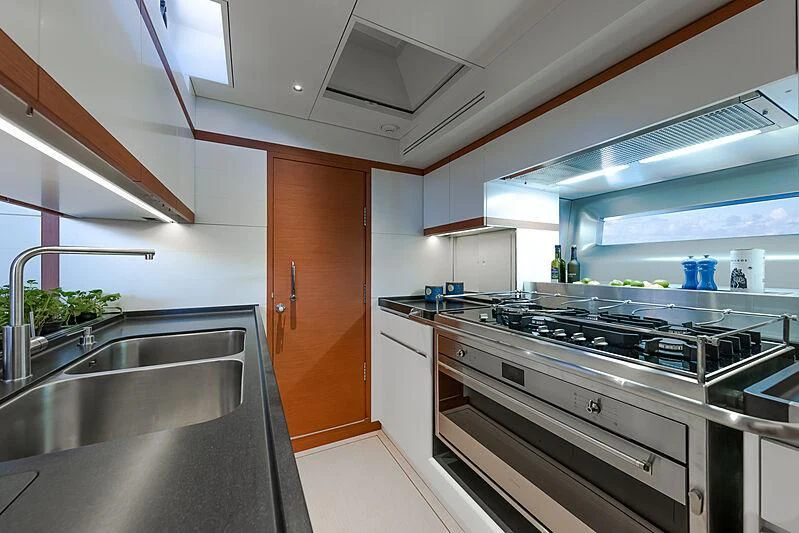a kitchen with a stainless steel sink aboard MORGANA Yacht for Sale
