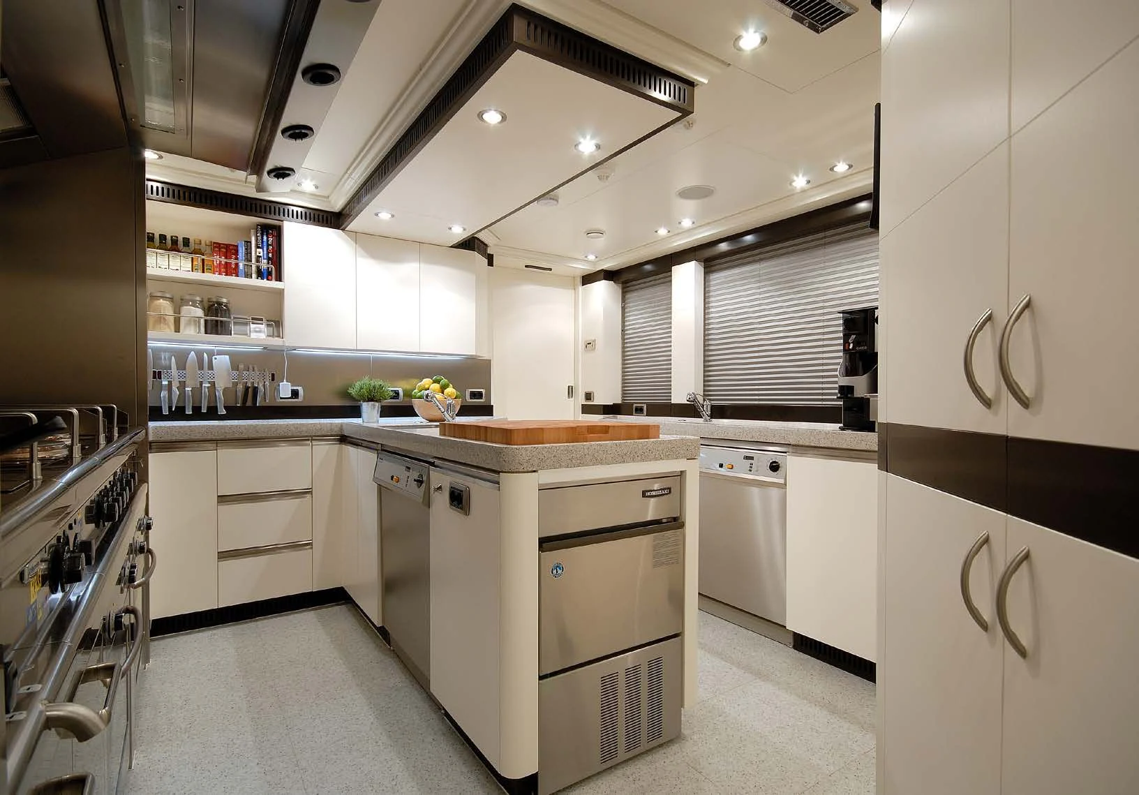 a kitchen with white cabinets aboard AQUAMARINA Yacht for Sale