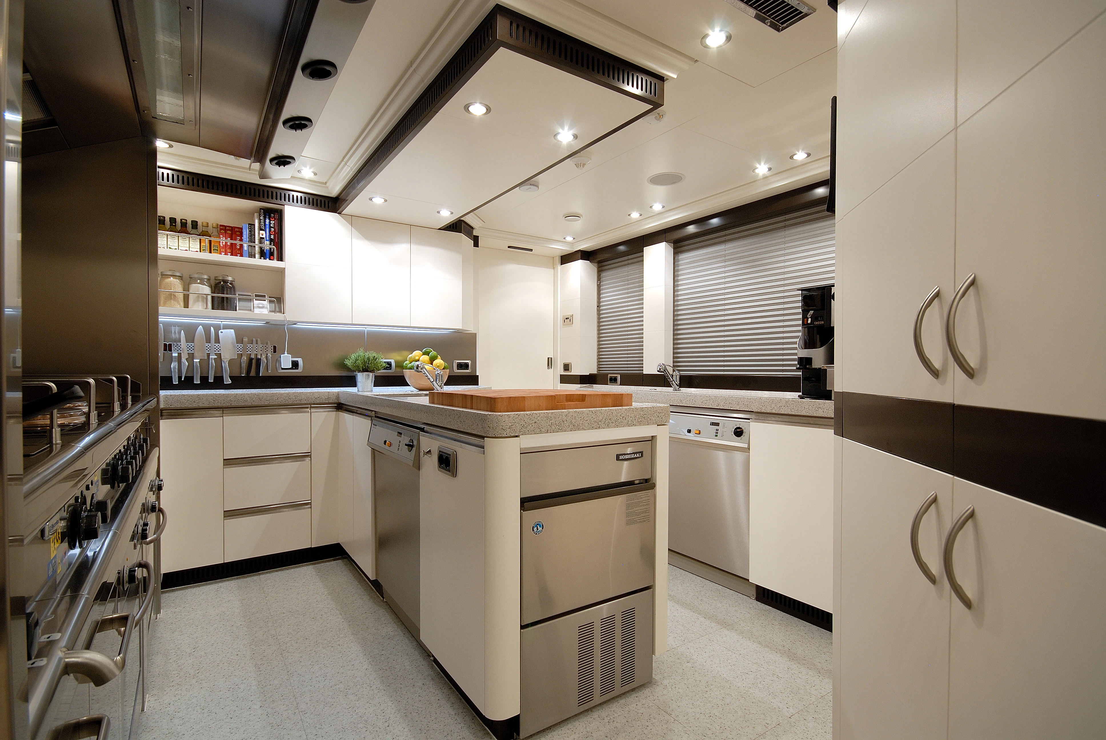 a kitchen with white cabinets aboard AQUAMARINA Yacht for Sale