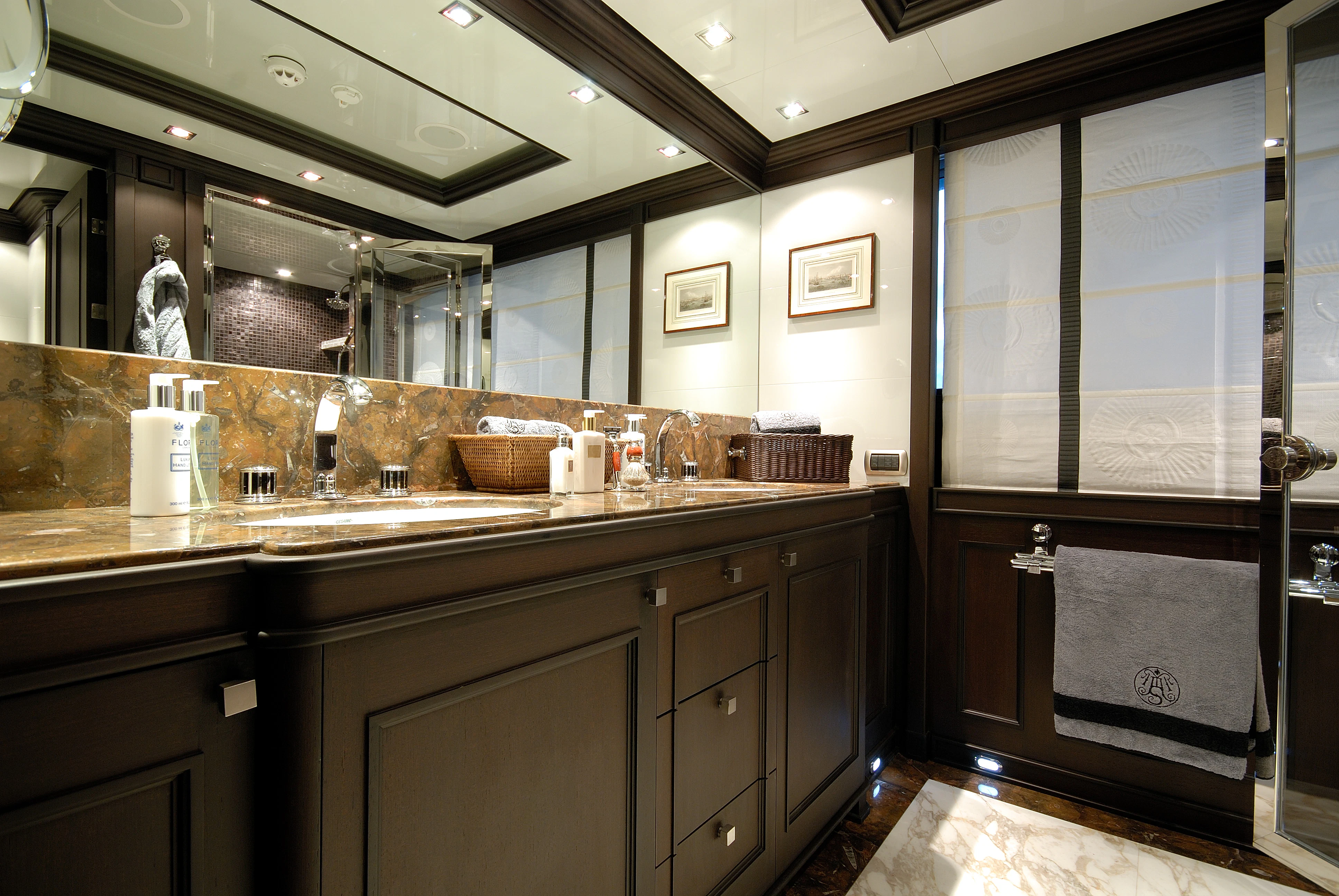 a bathroom with a large mirror aboard AQUAMARINA Yacht for Sale