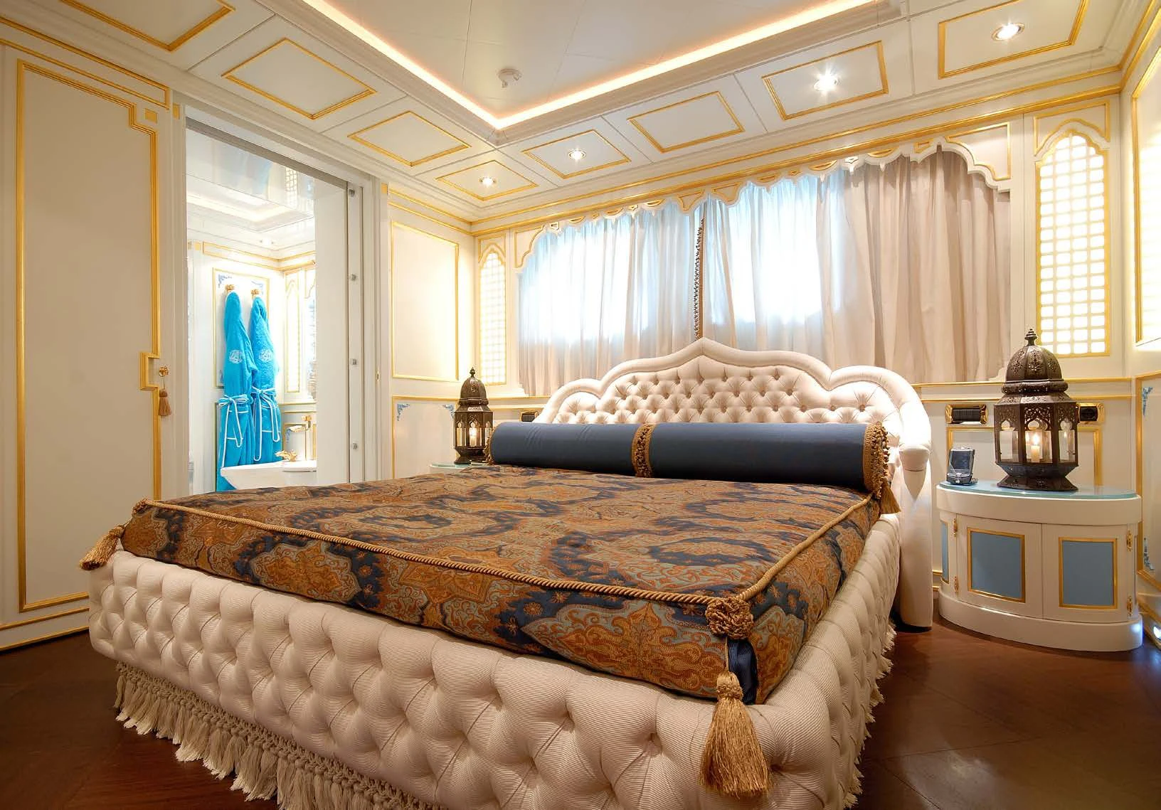 a bedroom with a bed and a dresser aboard AQUAMARINA Yacht for Sale