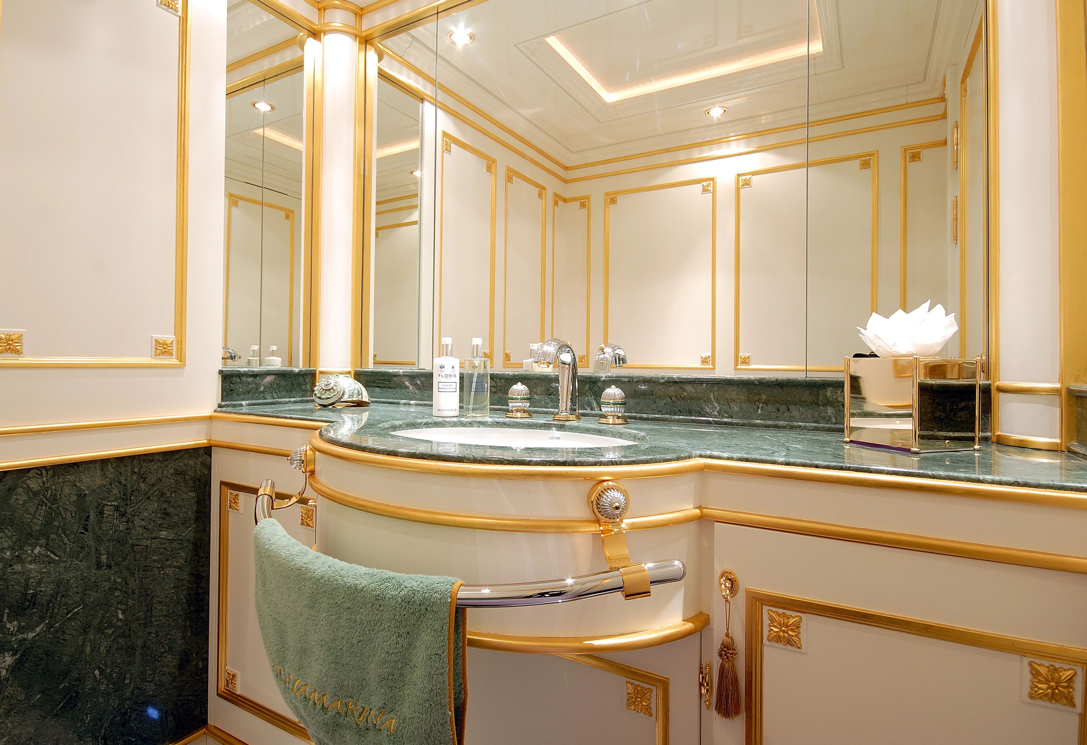 a bathroom with a sink and a mirror aboard AQUAMARINA Yacht for Sale