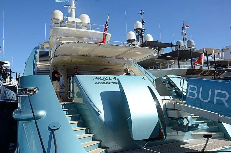 a large boat with a group of people on it aboard AQUAMARINA Yacht for Sale