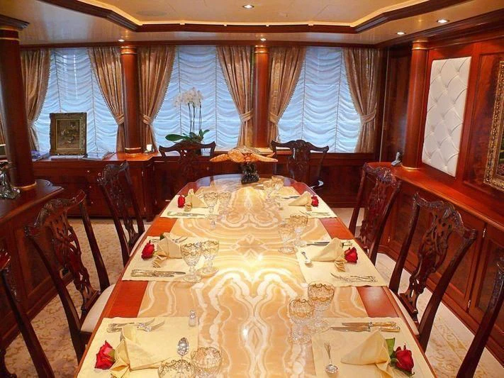 a dining table in a room aboard AQUAMARINA Yacht for Sale