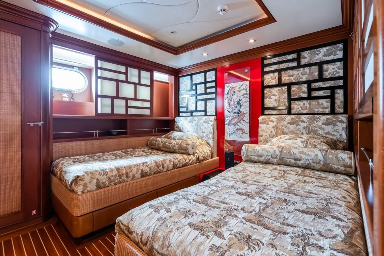 a bedroom with a bed and a window aboard AQUAMARINA Yacht for Sale