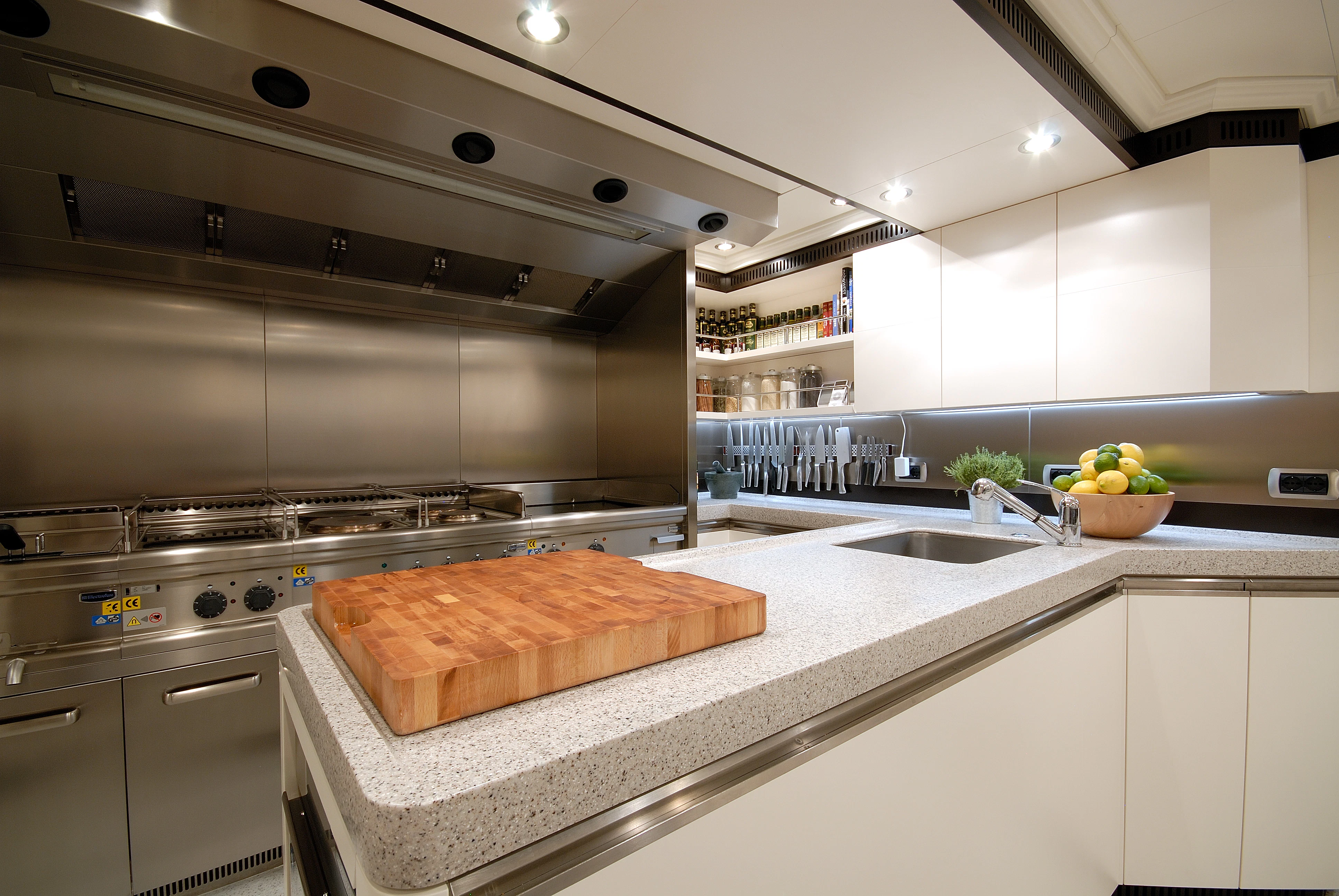 a kitchen with a large island aboard AQUAMARINA Yacht for Sale