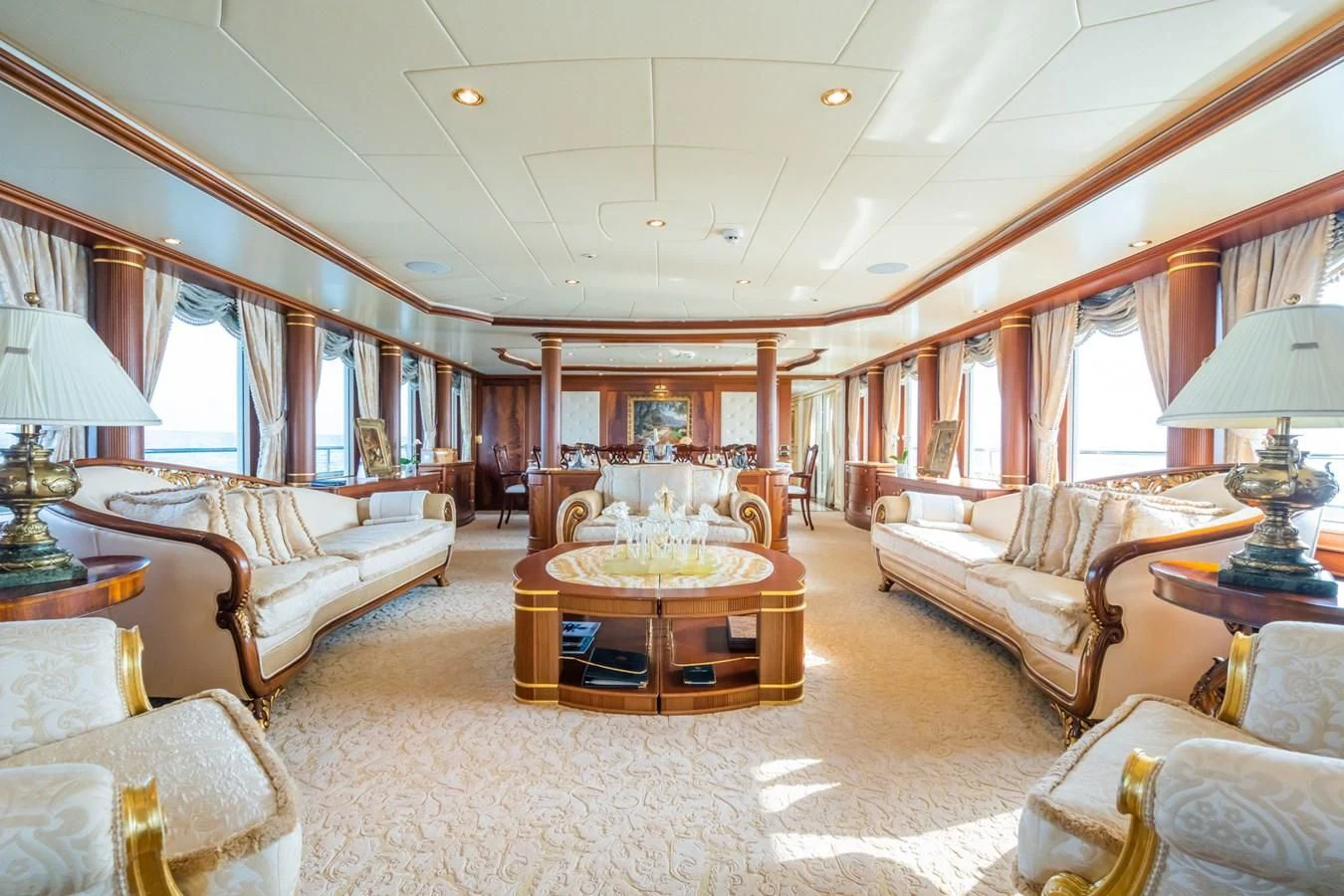 a living room with a fireplace aboard AQUAMARINA Yacht for Sale