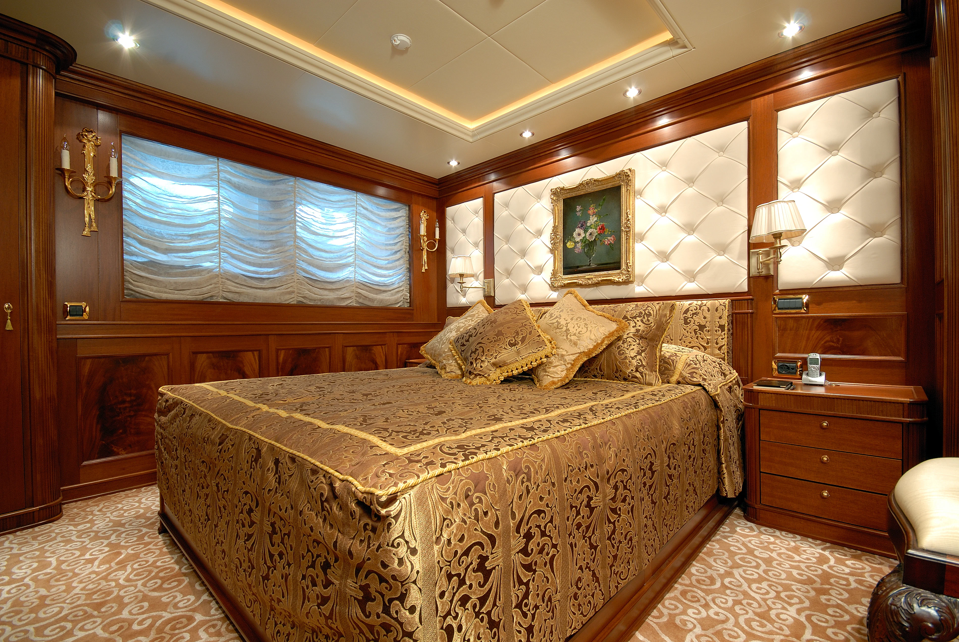 a bedroom with a large bed aboard AQUAMARINA Yacht for Sale
