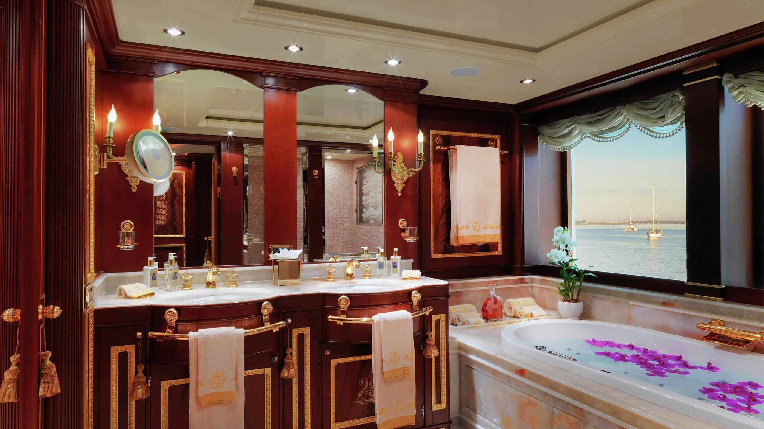 a bathroom with a large mirror aboard AQUAMARINA Yacht for Sale