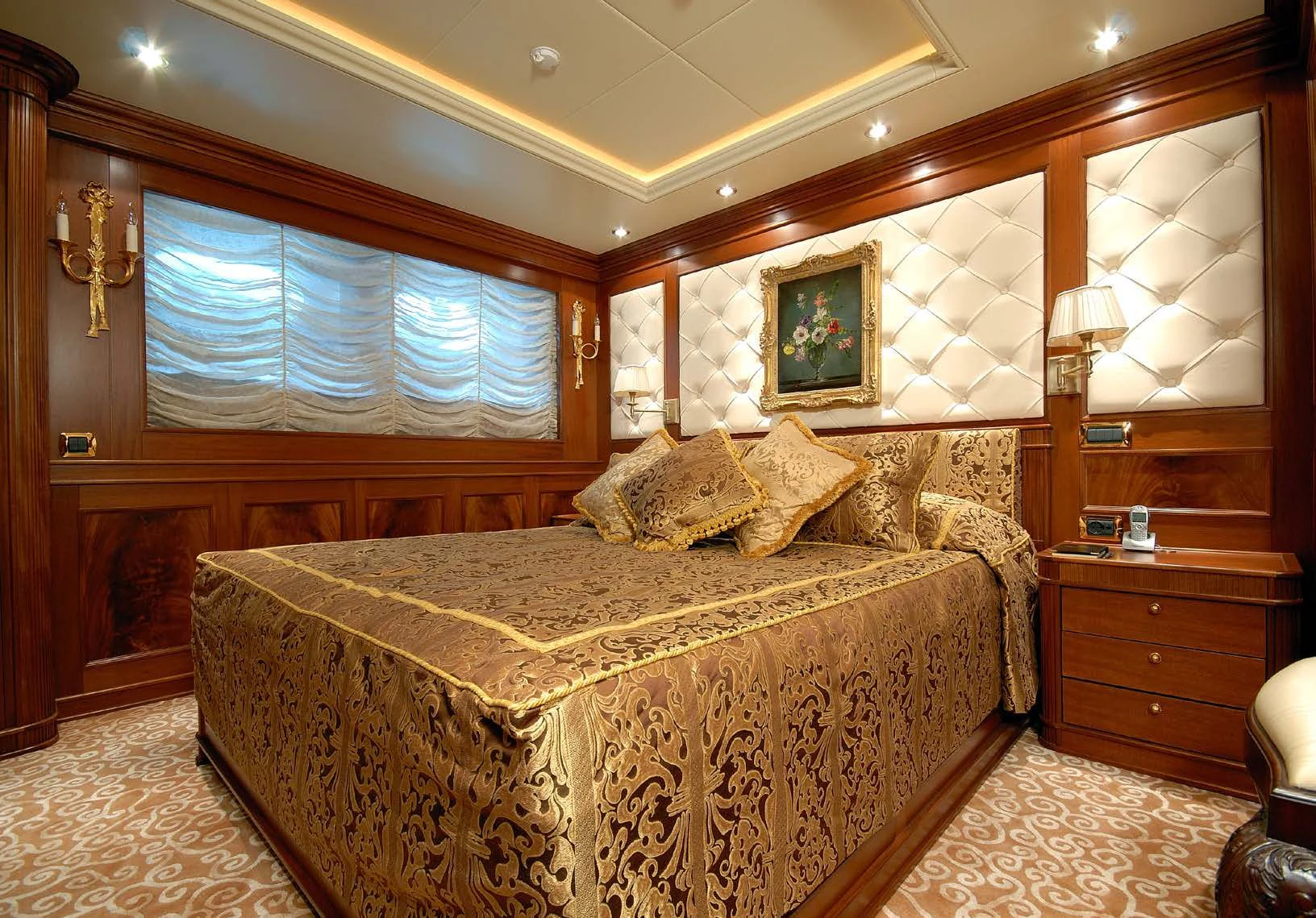a bedroom with a large bed aboard AQUAMARINA Yacht for Sale