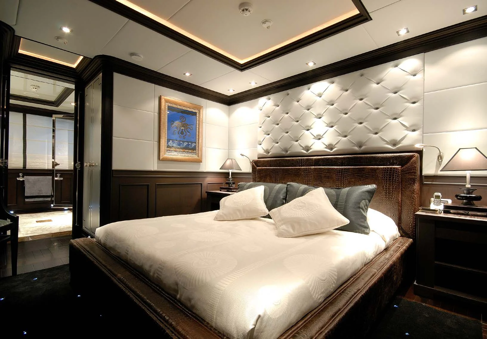 a large bed in a room aboard AQUAMARINA Yacht for Sale
