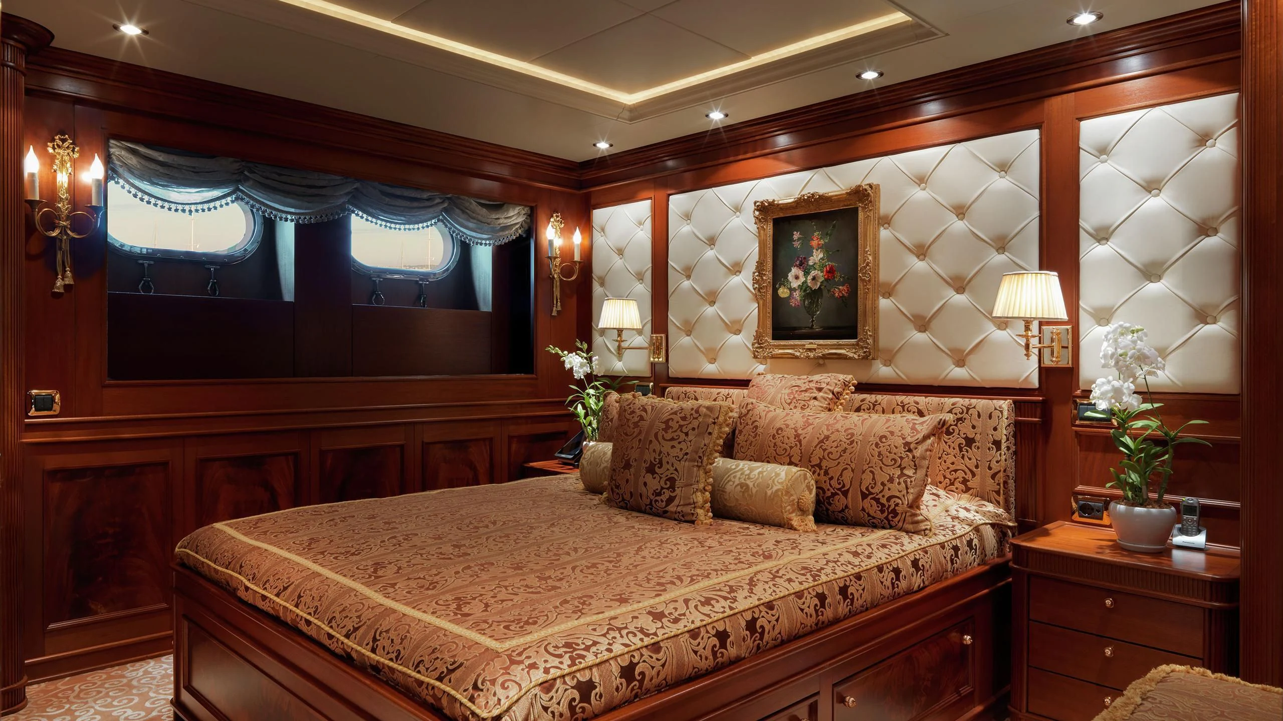 a large bed in a room aboard AQUAMARINA Yacht for Sale