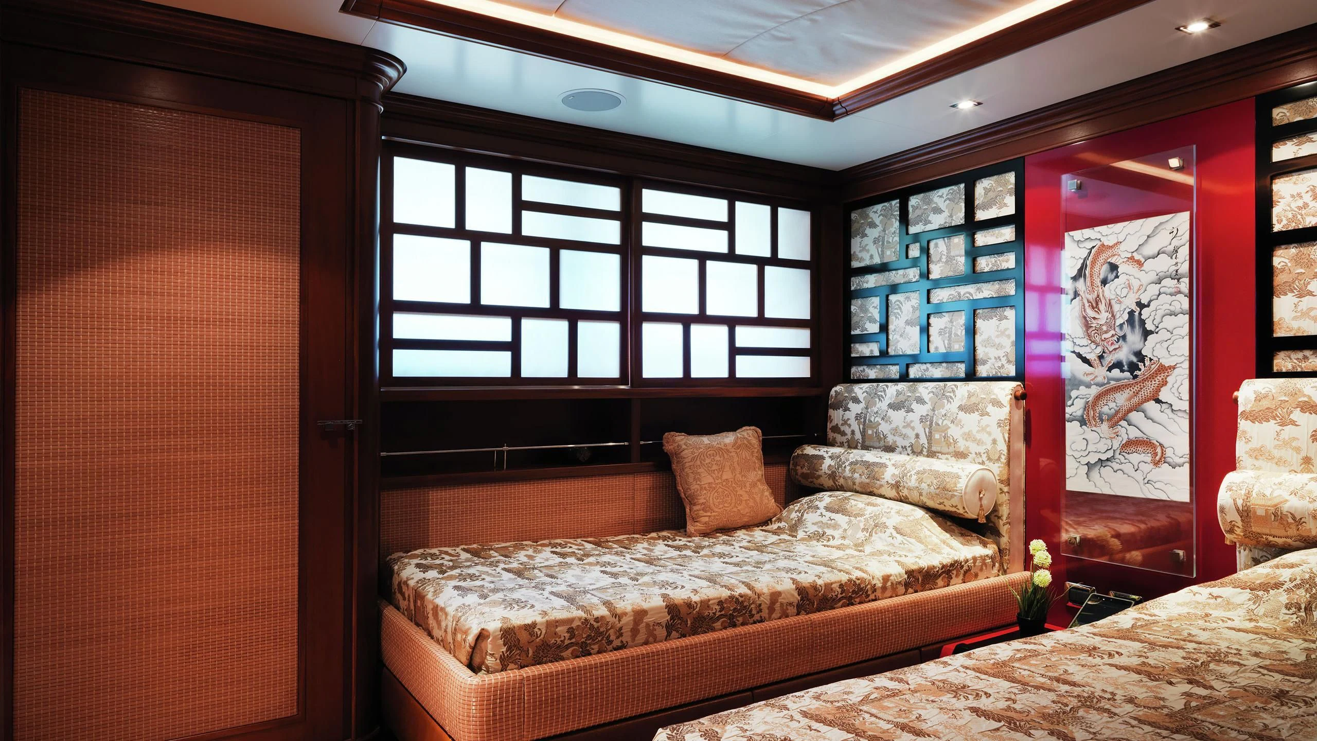 a room with a bed and a painting on the wall aboard AQUAMARINA Yacht for Sale