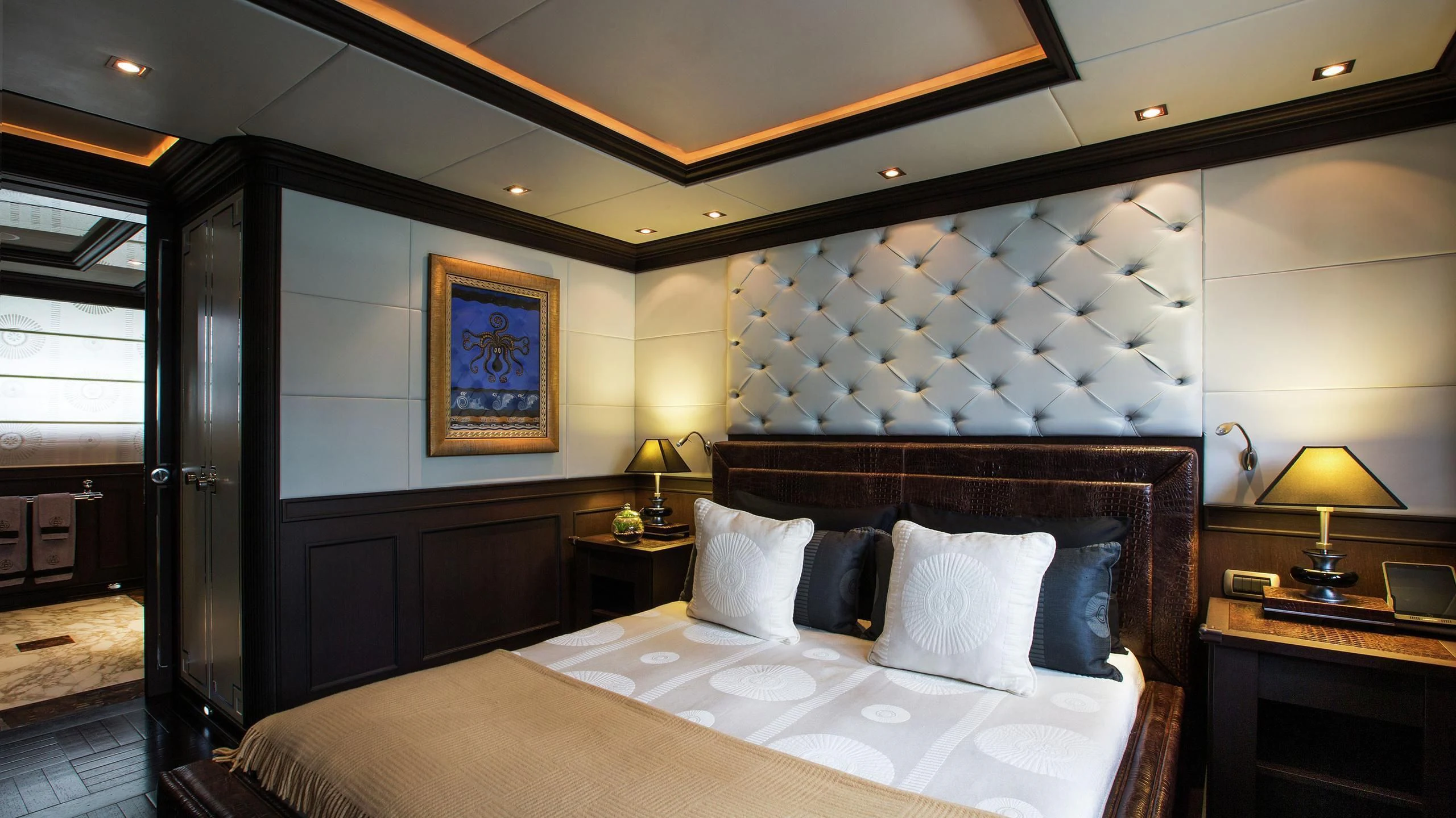 a large bed in a room aboard AQUAMARINA Yacht for Sale