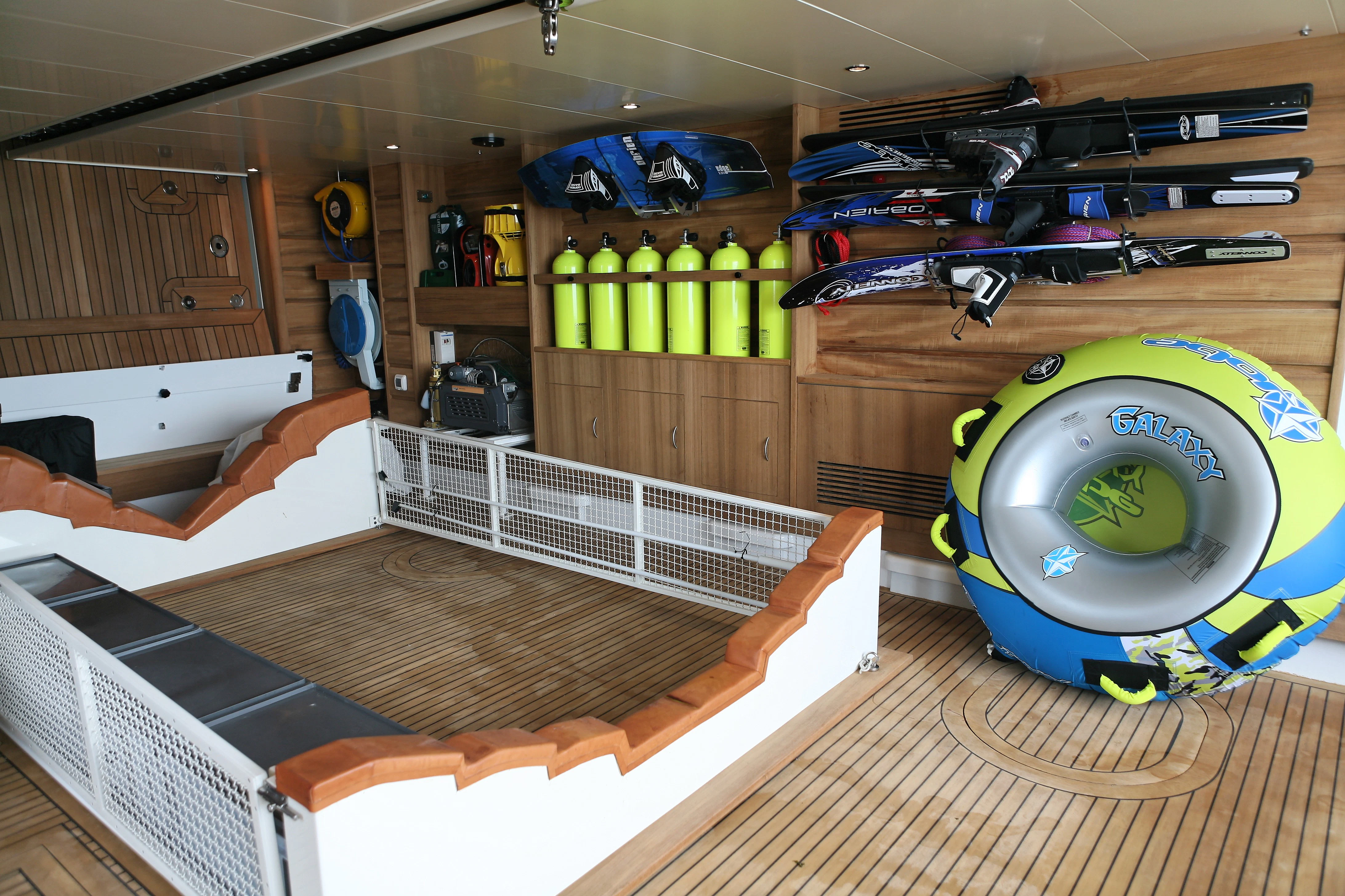 a room with a large blue ball and a green light aboard AQUAMARINA Yacht for Sale