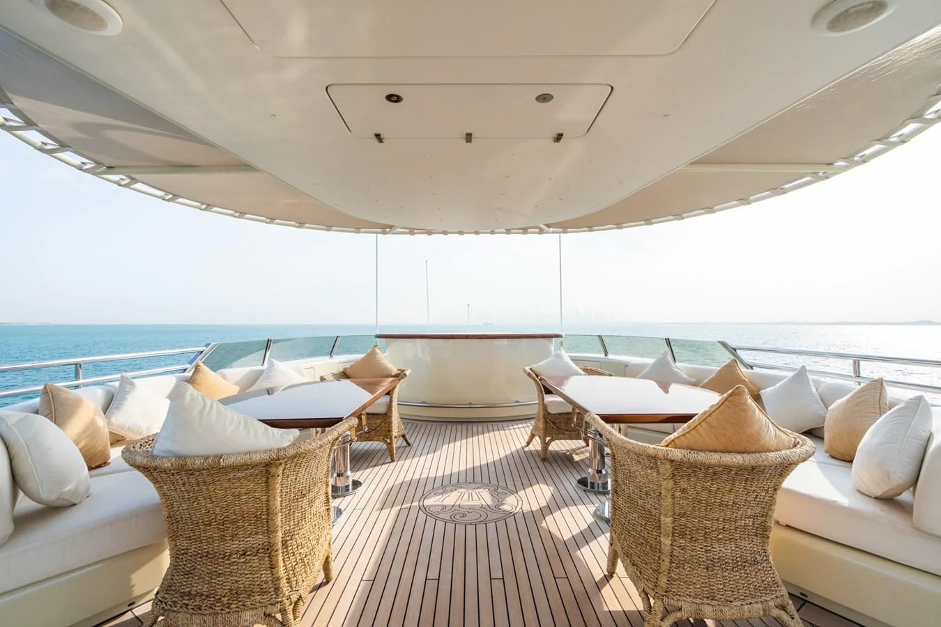 a room with a bed and a table and chairs aboard AQUAMARINA Yacht for Sale