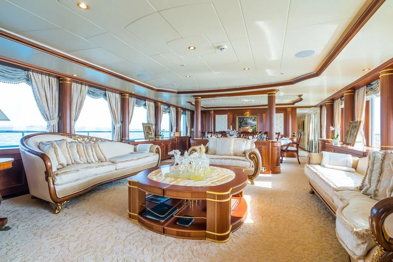 a living room with a couch and a table aboard AQUAMARINA Yacht for Sale
