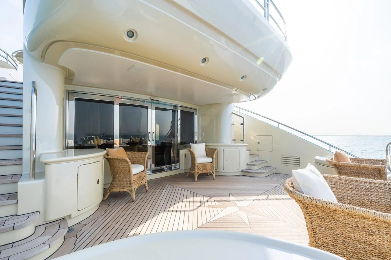 a large white room with a balcony aboard AQUAMARINA Yacht for Sale