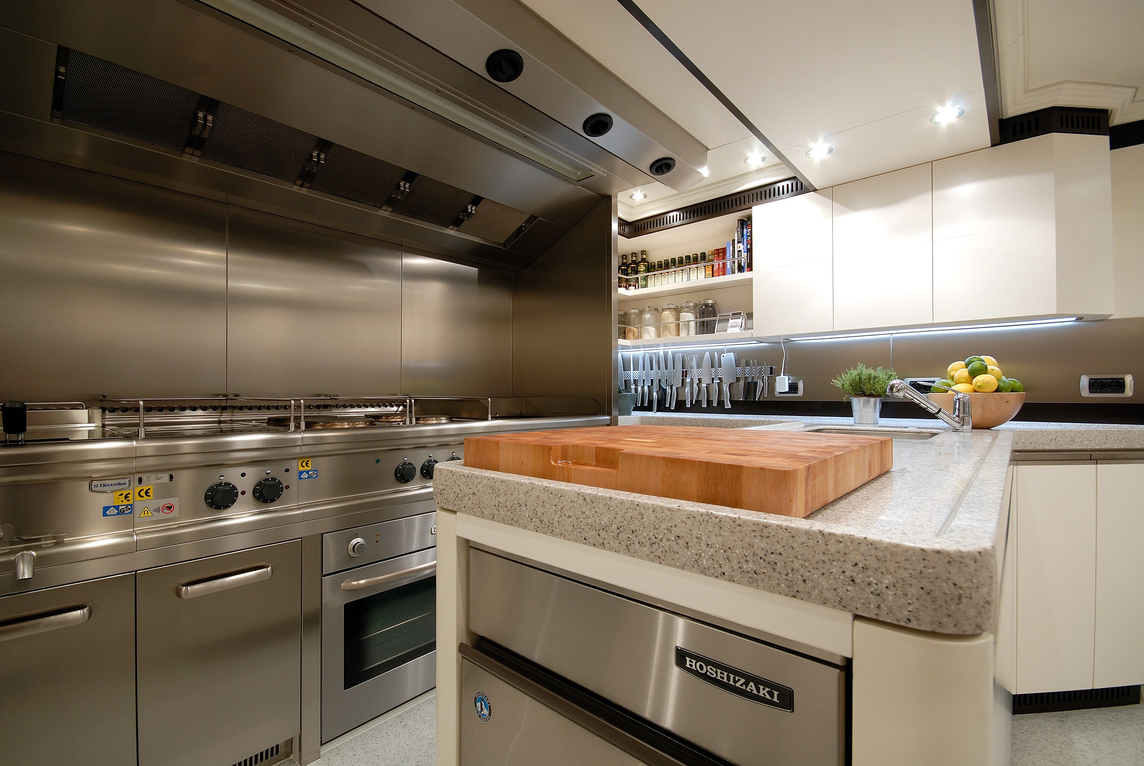 a kitchen with a large island aboard AQUAMARINA Yacht for Sale