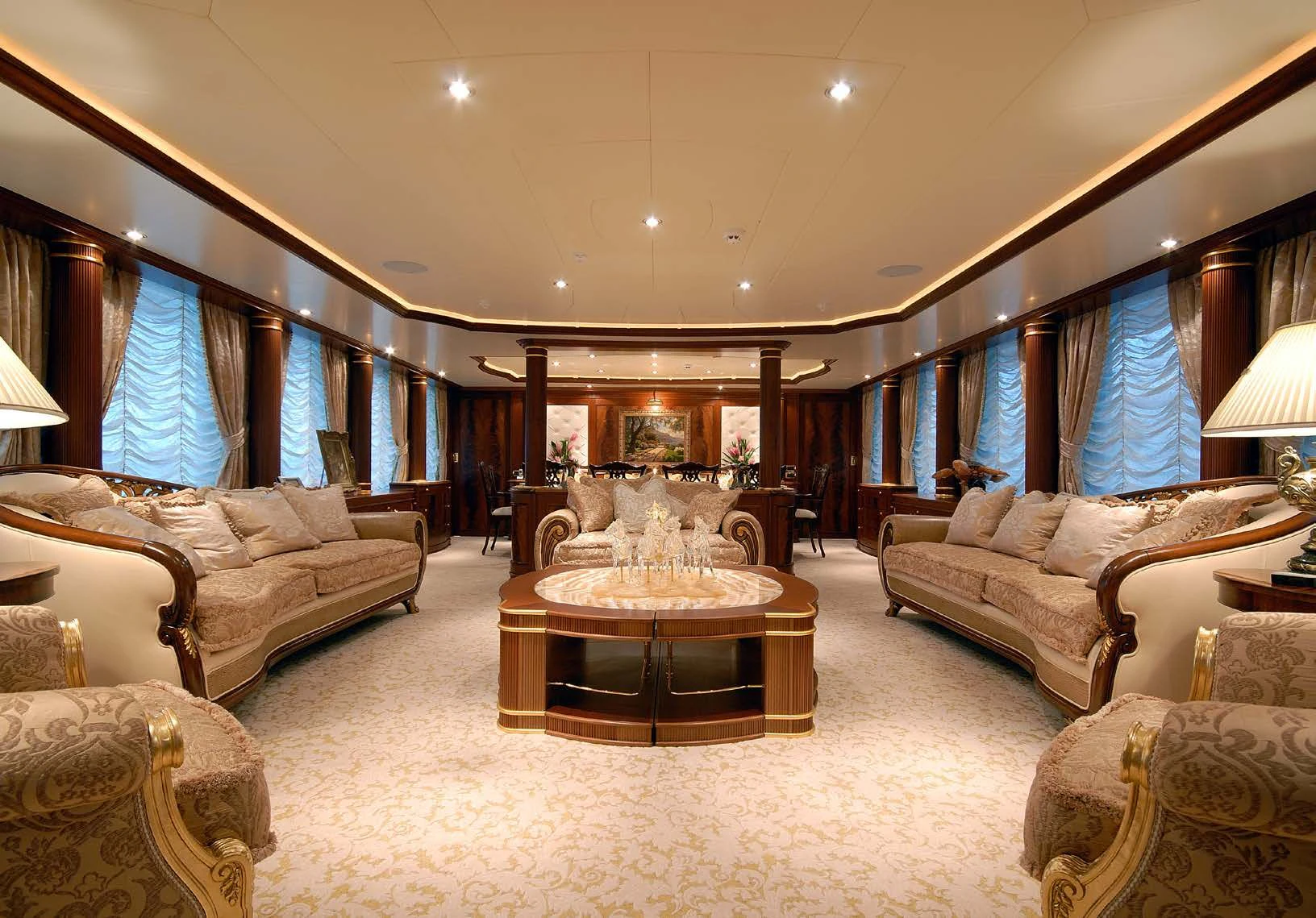 a large living room with a large fireplace aboard AQUAMARINA Yacht for Sale