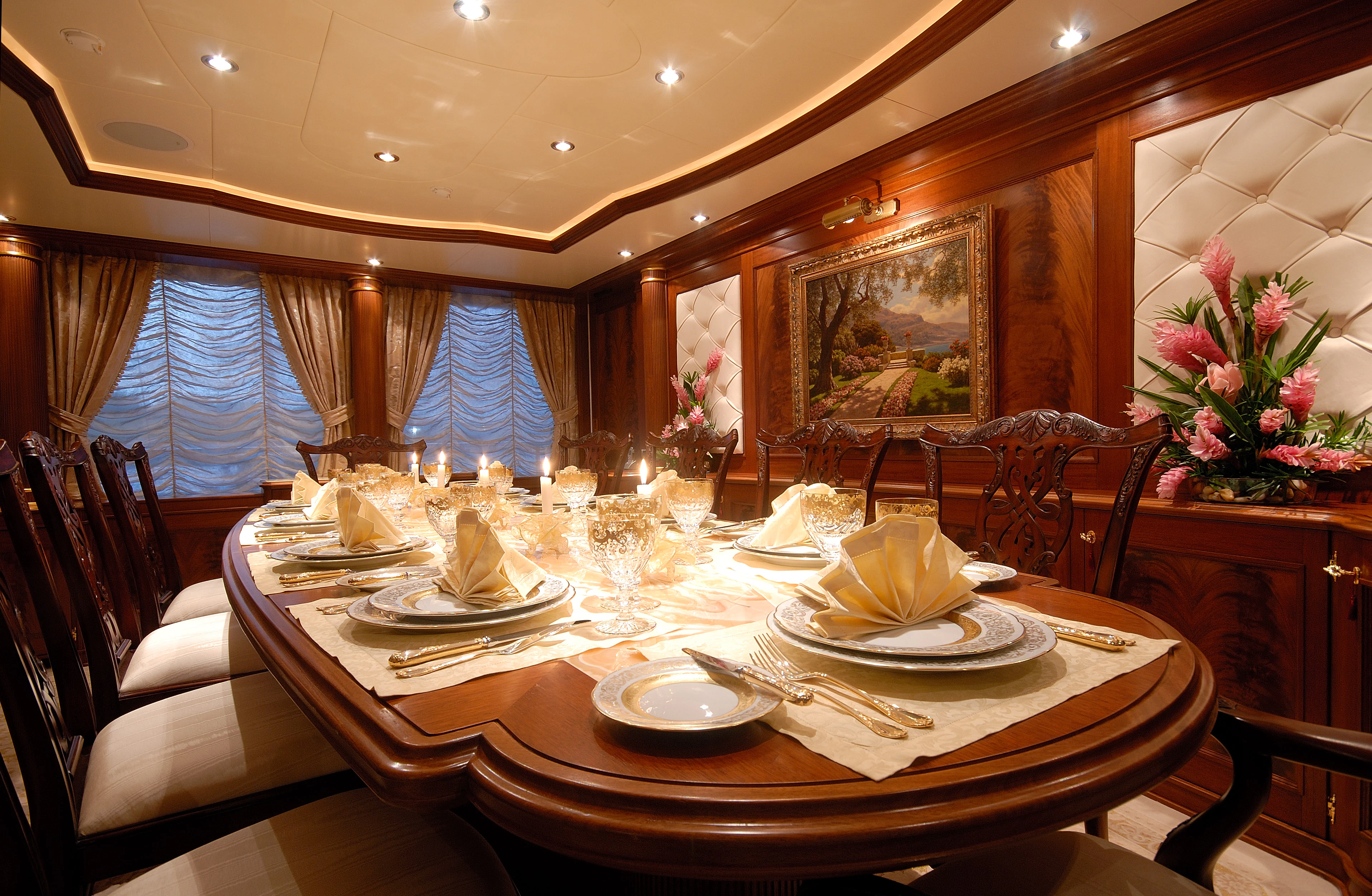 a table set with plates and glasses aboard AQUAMARINA Yacht for Sale