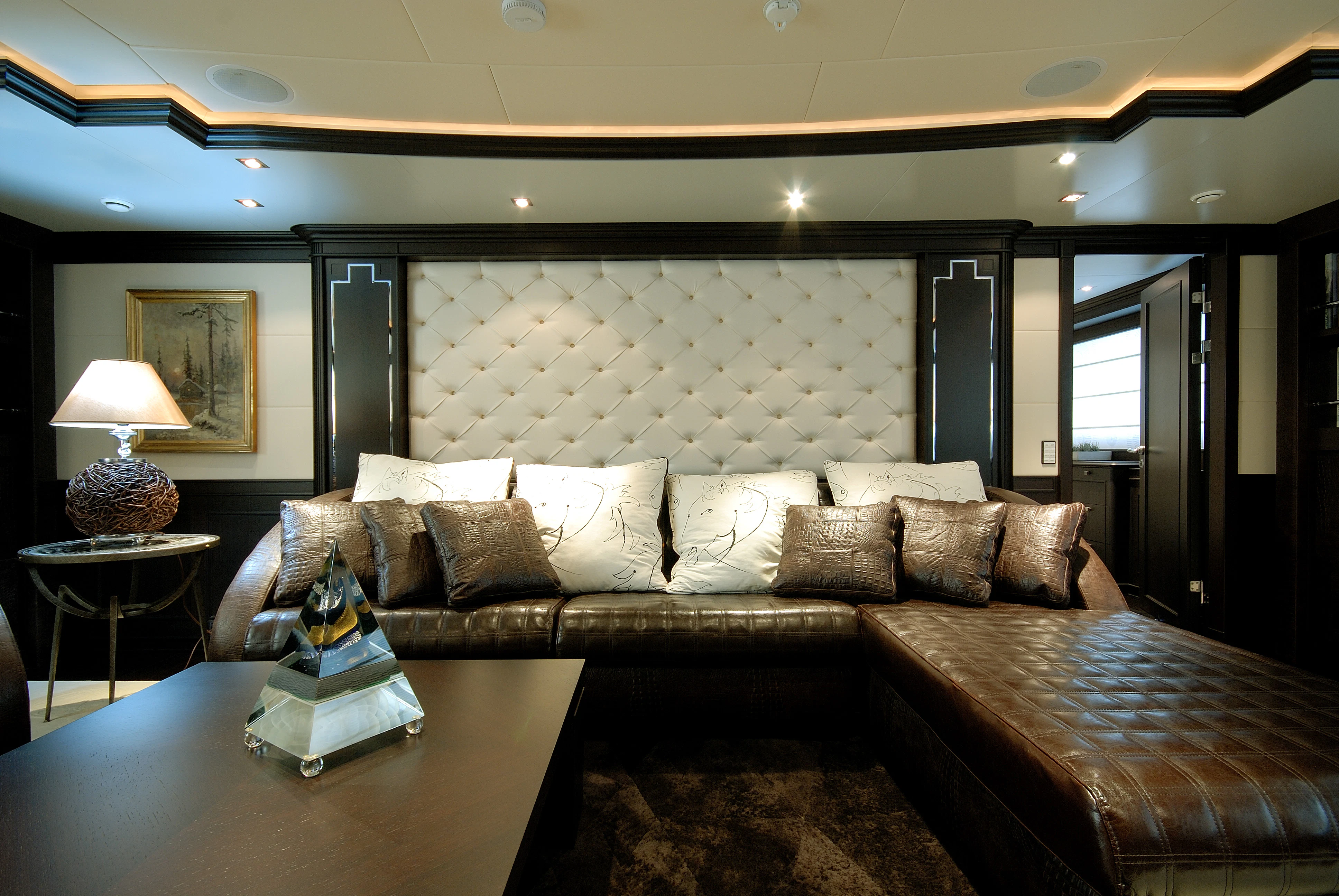 a living room with a couch and a table aboard AQUAMARINA Yacht for Sale