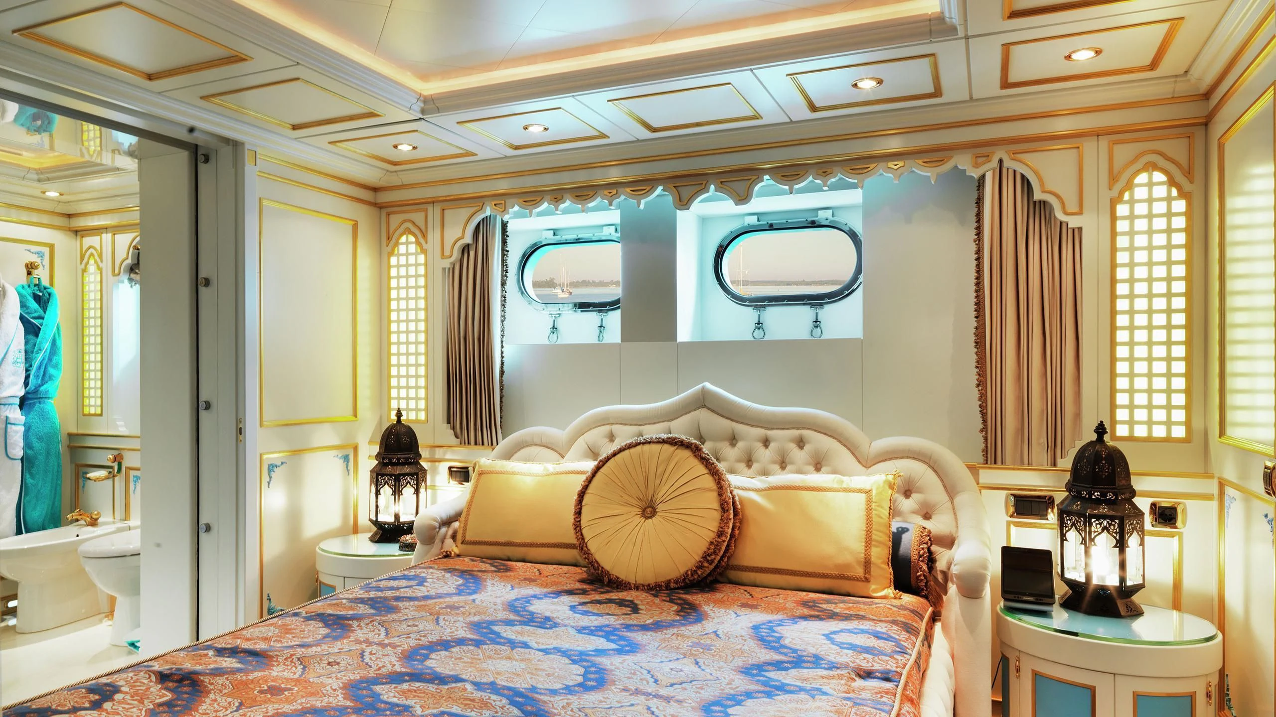 a room with a bed and a chair aboard AQUAMARINA Yacht for Sale